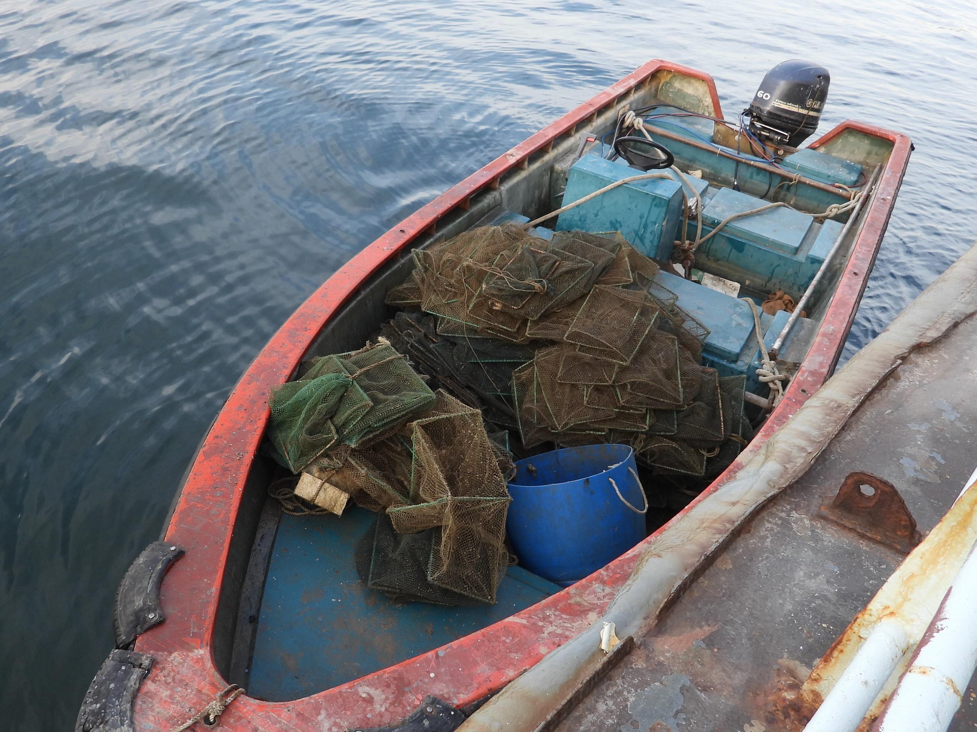 The Agriculture, Fisheries and Conservation Department today (August 12) laid charges against two Mainlanders on board a Mainland vessel suspected of engaging in illegal fishing in waters off Sam Mun Tsai, Tai Po. Photo shows the Mainland vessel concerned.