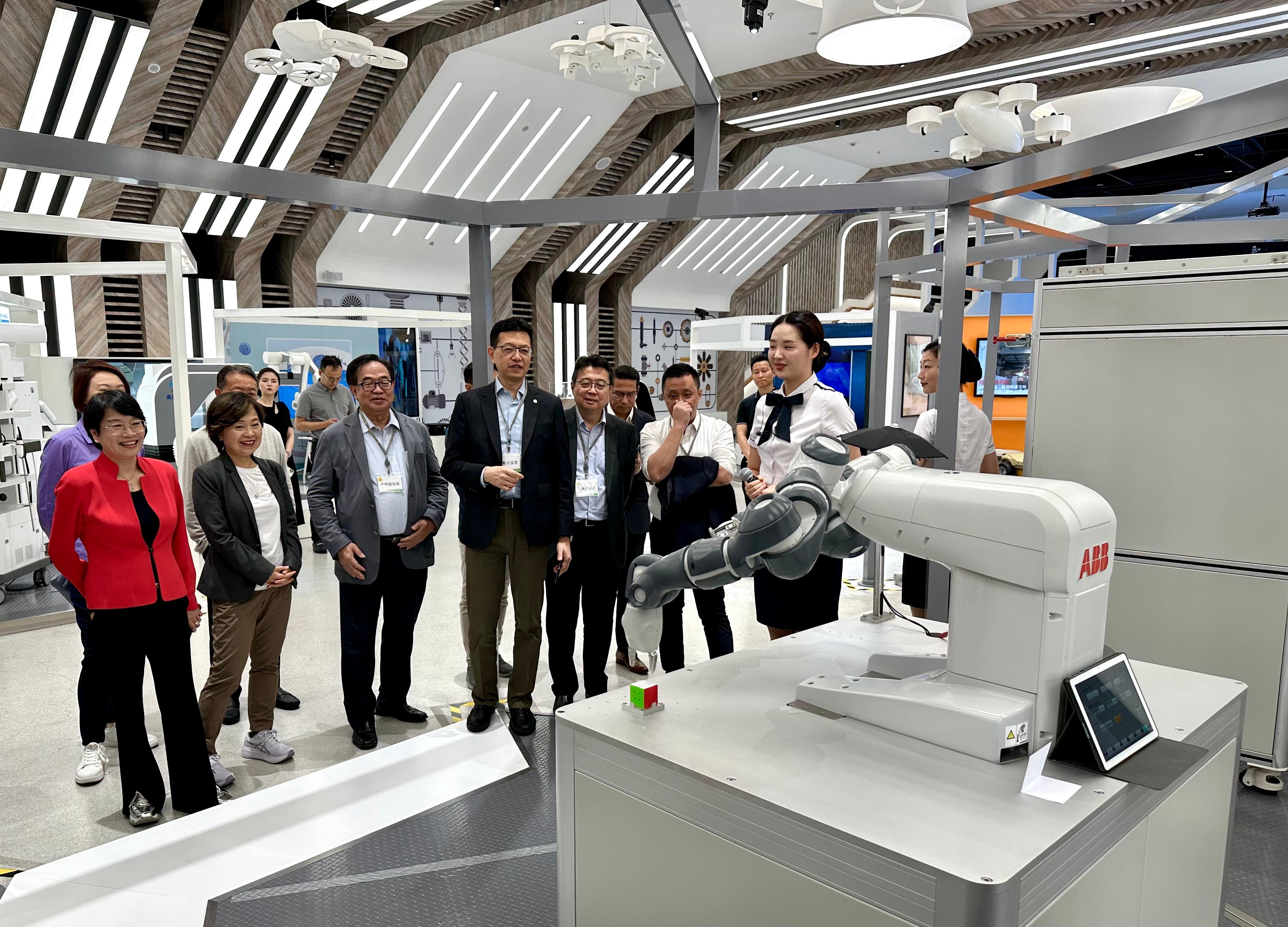 The Secretary for Education, Dr Choi Yuk-lin, together with the Legislative Council Panel on Education delegation, continued their visit to Shanghai today (August 14). Photo shows Dr Choi (second left) and the delegation visiting the Zhangjiang AI Robot Valley, an innovation hub.