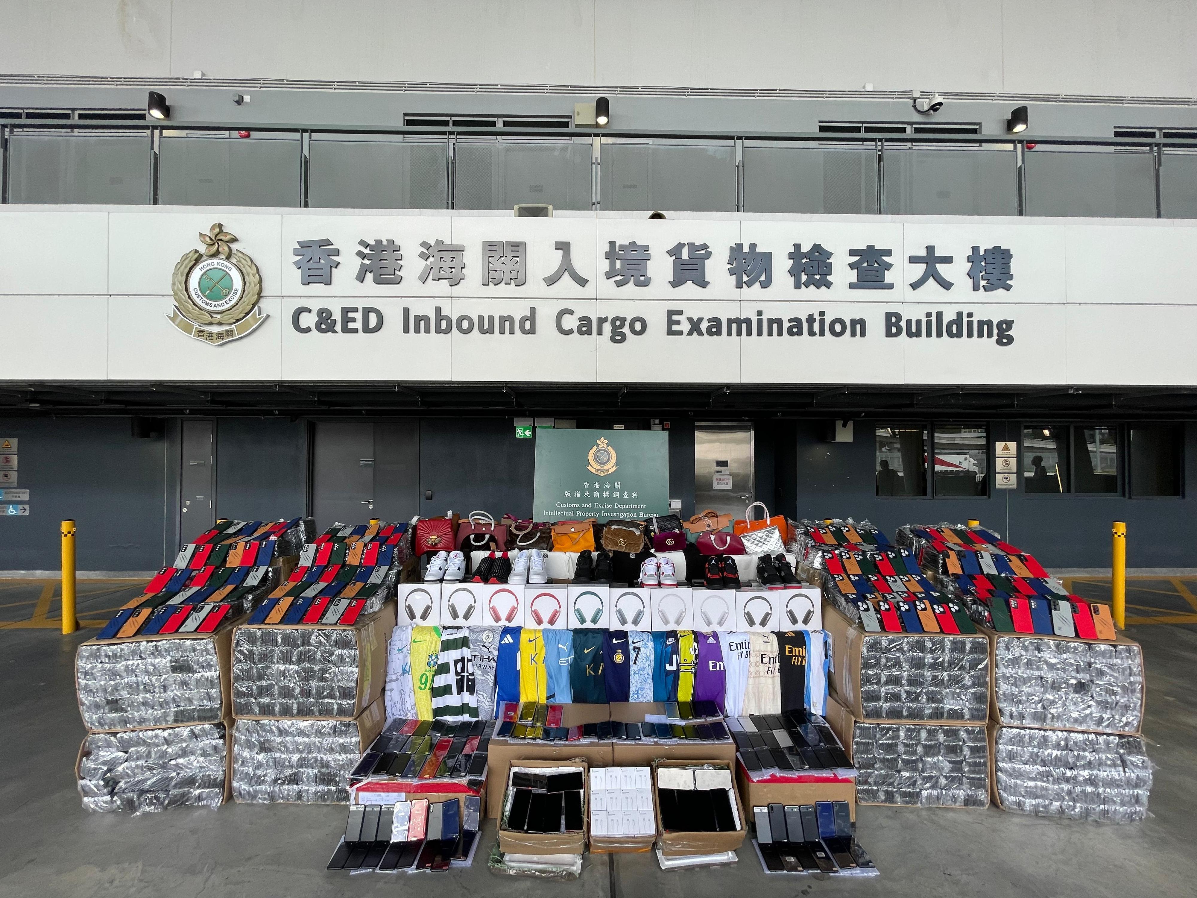 Hong Kong Customs on August 1 seized about 15 000 suspected counterfeit goods, with an estimated market value of about $1.1 million, at the Inbound Cargo Examination Building of the Heung Yuen Wai Boundary Control Point. Photo shows the suspected counterfeit goods seized.