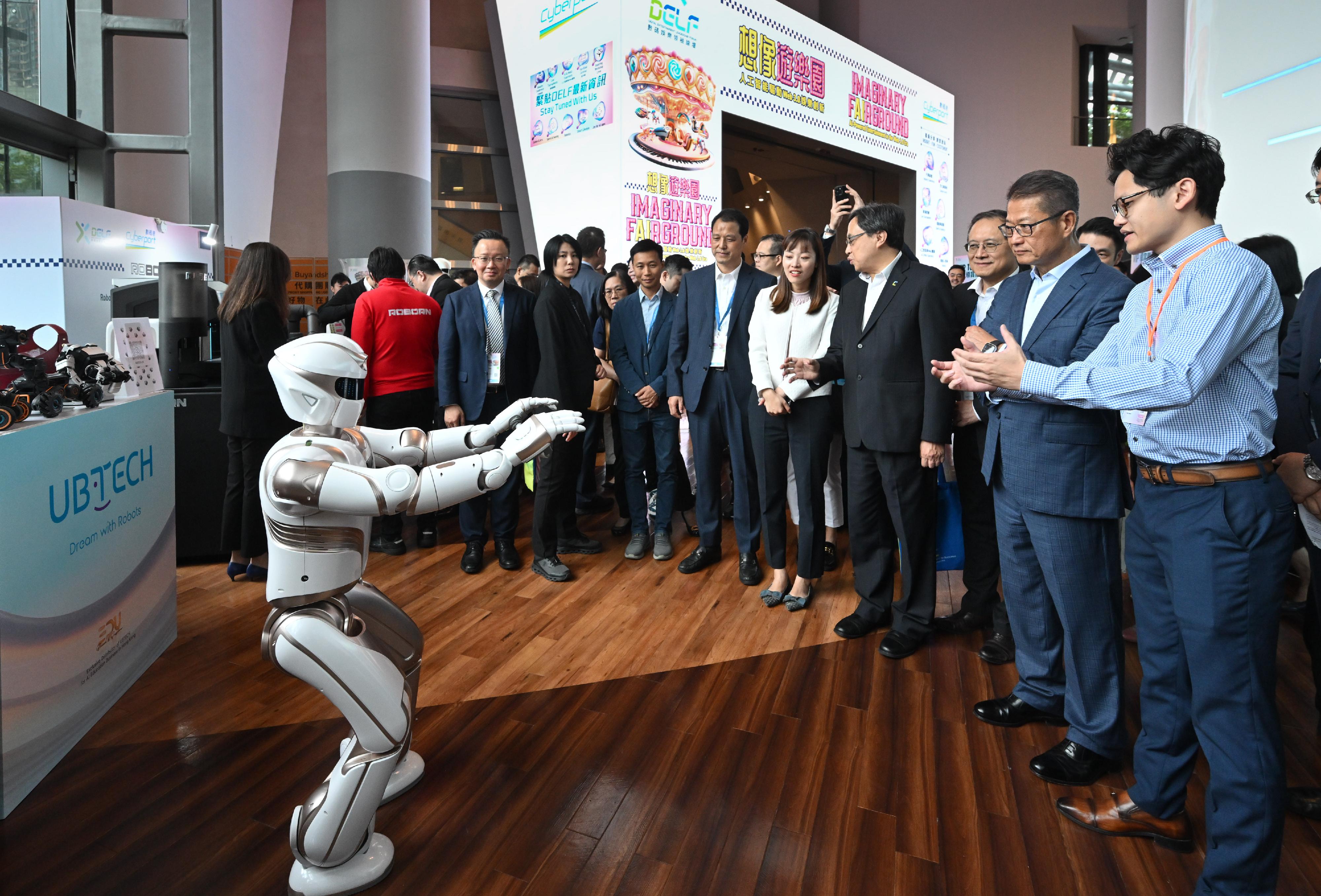 The Financial Secretary, Mr Paul Chan, attended the Digital Entertainment Leadership Forum 2024 today (August 16). Photo shows Mr Chan (second right) touring the experience zones.