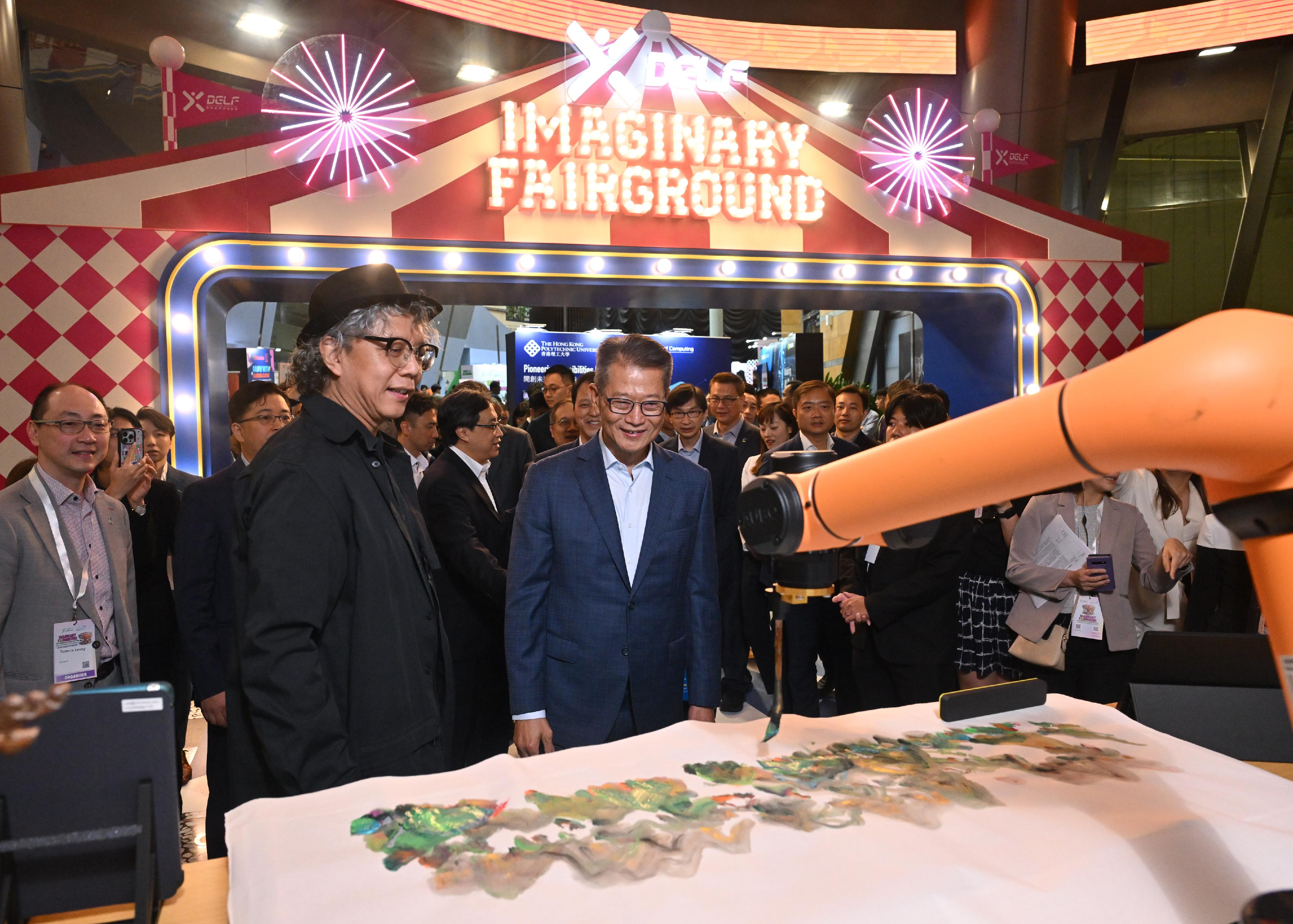 The Financial Secretary, Mr Paul Chan, attended the Digital Entertainment Leadership Forum 2024 today (August 16). Photo shows Mr Chan (front row, second left) touring the experience zones.