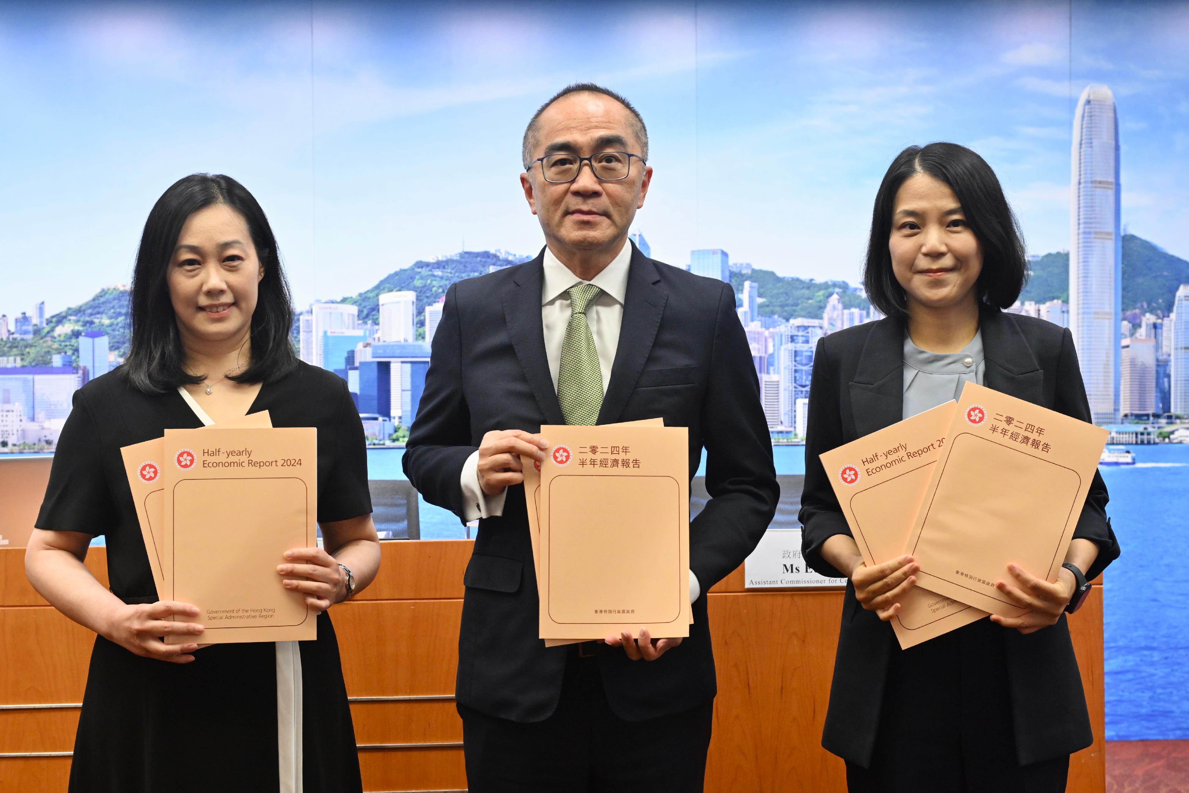 The Government Economist, Mr Adolph Leung (centre), presents the Half-yearly Economic Report 2024 at a press conference today (August 16). Also present are Principal Economist Ms Joyce Cheung (left) and Assistant Commissioner for Census and Statistics Ms Edith Chan (right).