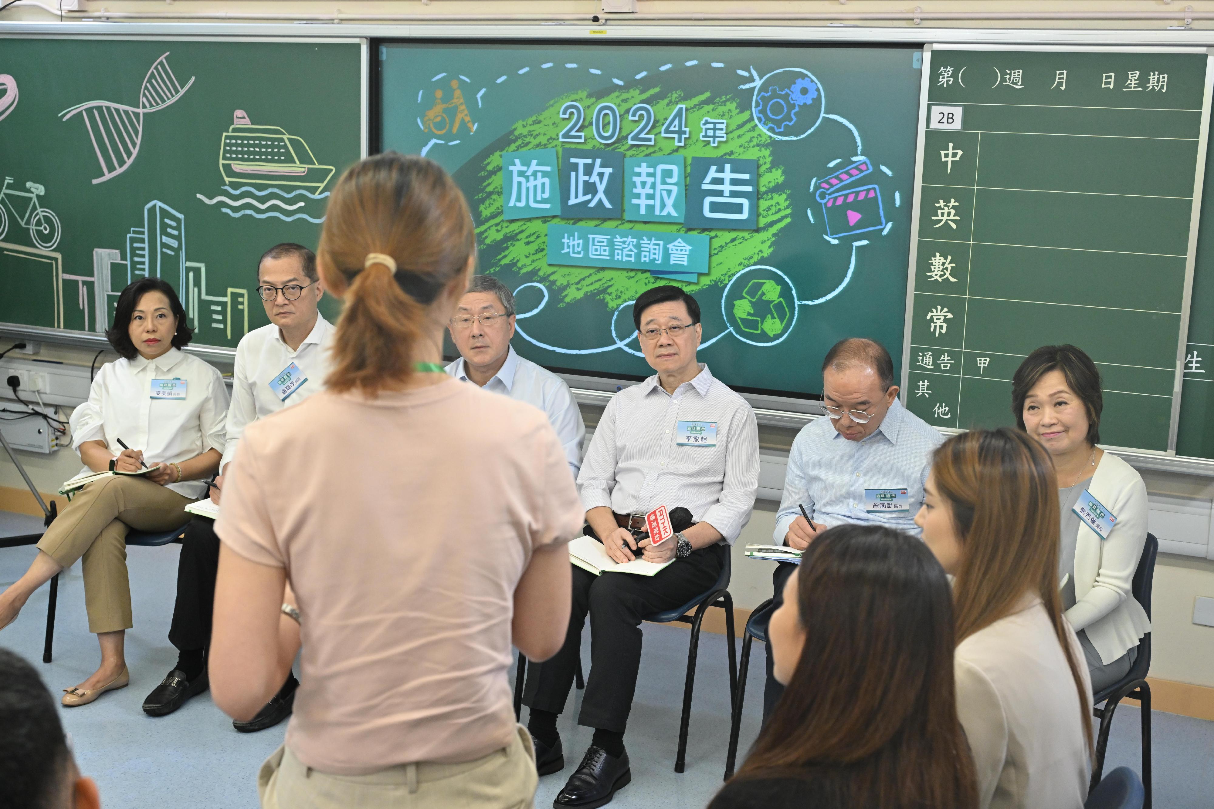 The Chief Executive, Mr John Lee, attended the 2024 Policy Address District Forum with some Principal Officials this morning (August 18) to listen to views and suggestions of local community members on the upcoming Policy Address. Photo shows (from left) the Secretary for Home and Youth Affairs, Miss Alice Mak; the Secretary for Health, Professor Lo Chung-mau; the Deputy Chief Secretary for Administration, Mr Cheuk Wing-hing; Mr Lee; the Secretary for Constitutional and Mainland Affairs, Mr Erick Tsang Kwok-wai; and the Secretary for Education, Dr Choi Yuk-lin, listening to views of the public at the consultation session.