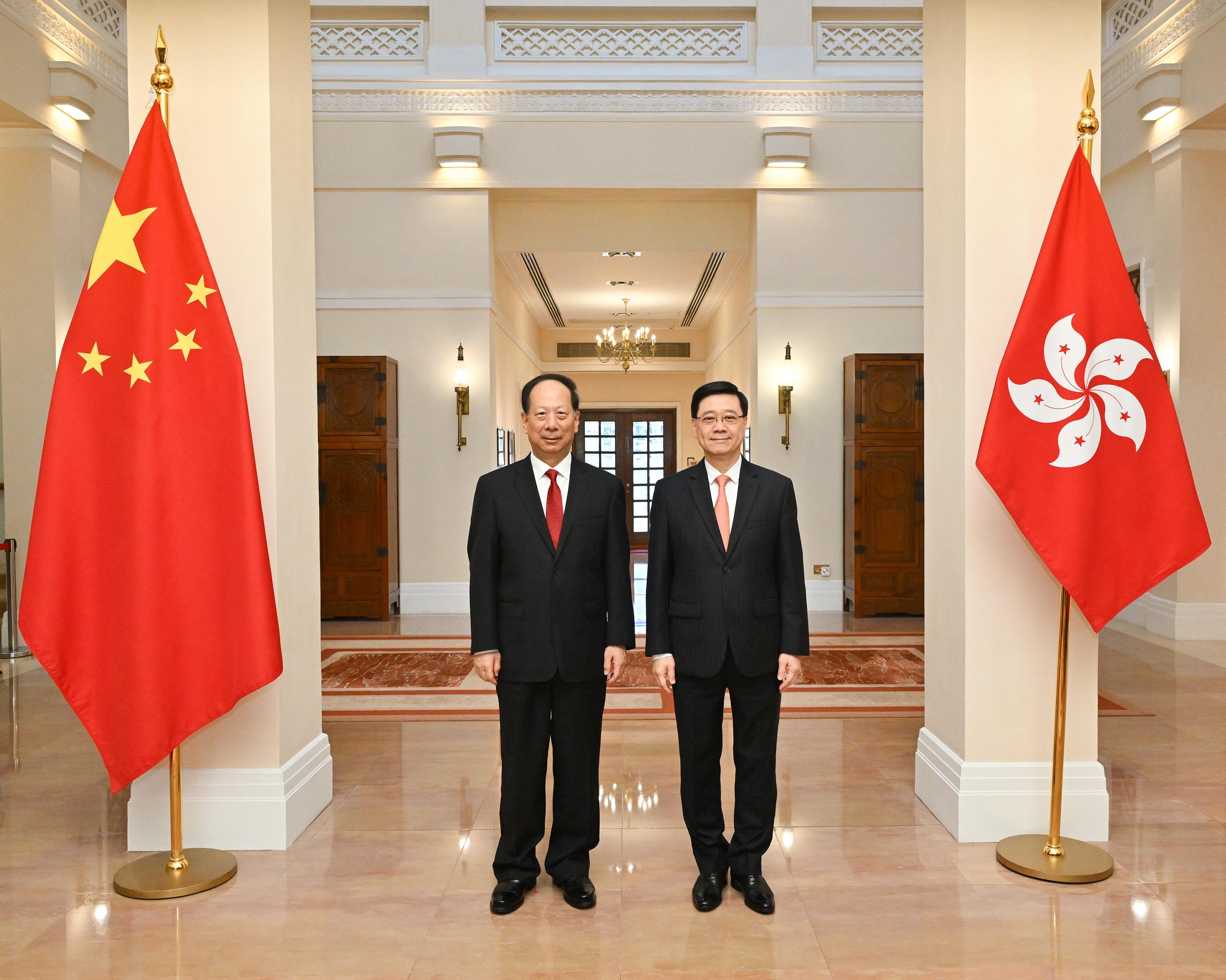 The Chief Executive, Mr John Lee (right), meets with Member of the Political Bureau of the Communist Party of China (CPC) Central Committee, Vice-Chairman of the National Committee of the Chinese People's Political Consultative Conference, and Head of the United Front Work Department of the CPC Central Committee, Mr Shi Taifeng (left), at Government House today (August 19).