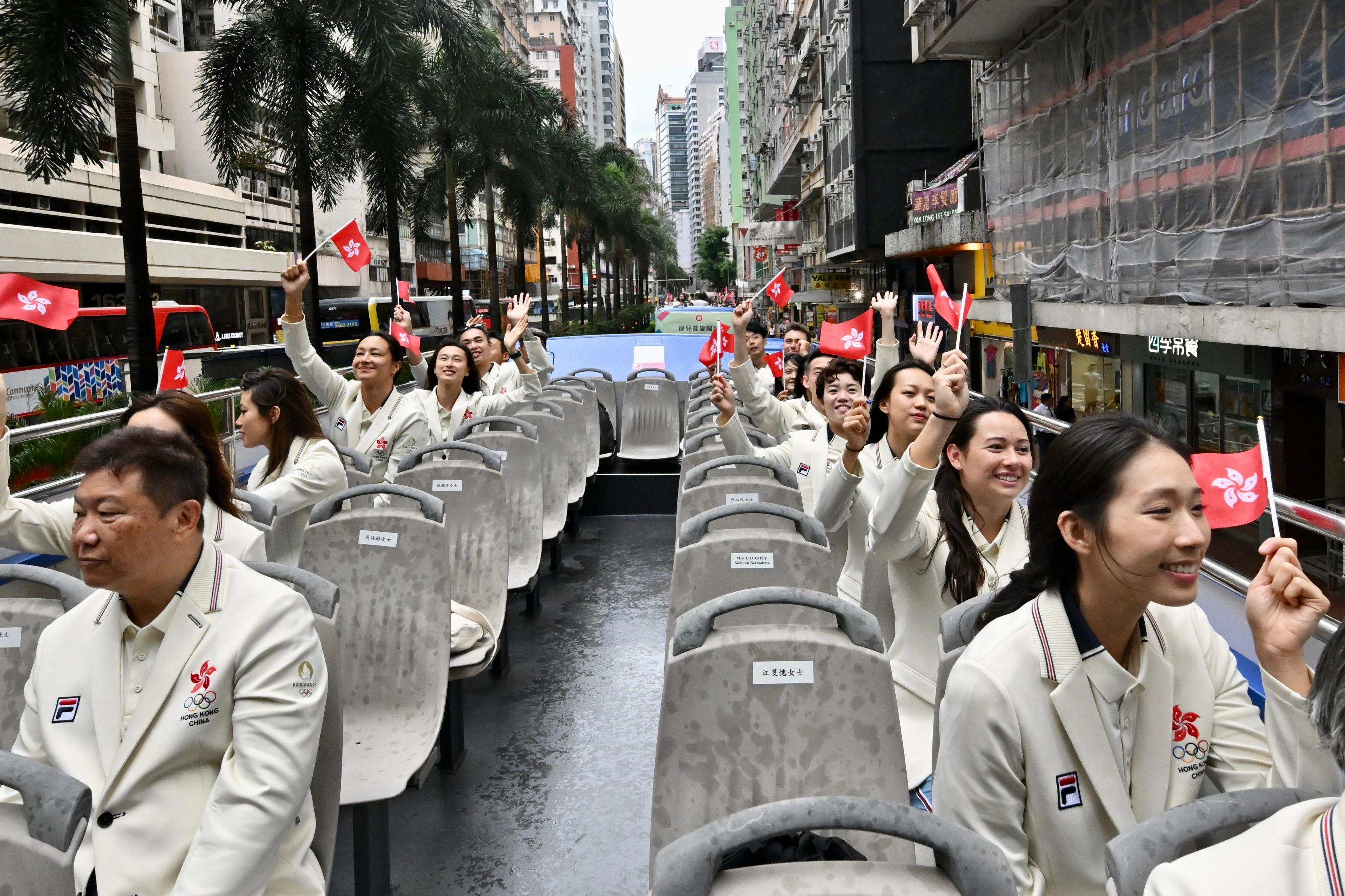 The Hong Kong Special Administrative Region Government and the Sports Federation & Olympic Committee of Hong Kong, China arranged a bus parade and Welcome Home Reception today (August 21) for the Hong Kong, China Delegation to the 2024 Paris Olympic Games. Photo shows athletes and other Delegation members in the bus parade.
