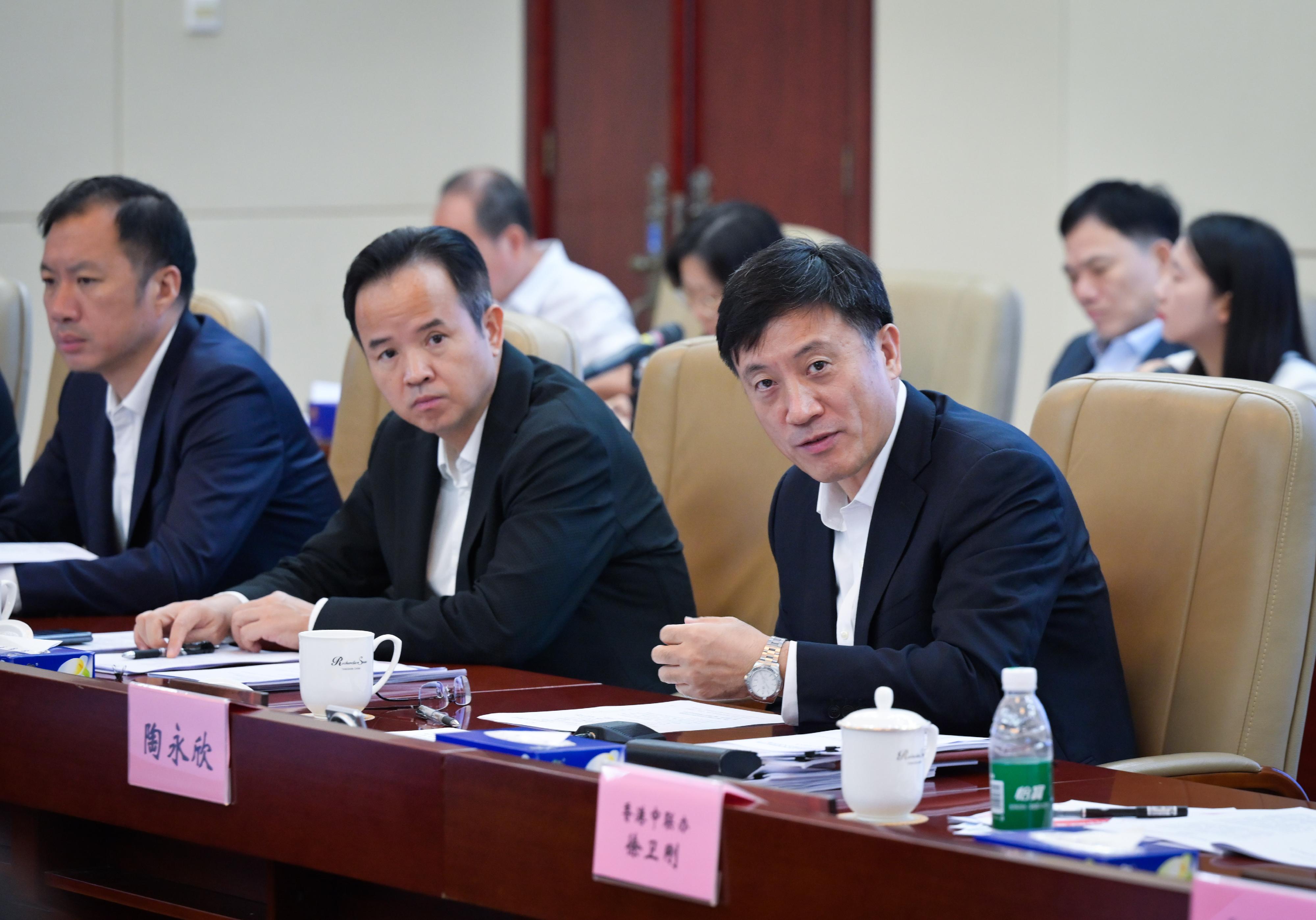 The Deputy Financial Secretary, Mr Michael Wong, and Vice Mayor of the Shenzhen Municipal People's Government Mr Tao Yongxin (right), leading delegations of the governments of the Hong Kong Special Administrative Region and Shenzhen respectively, held a meeting of the Task Force for Collaboration on the Northern Metropolis Development Strategy in Shenzhen today (August 21).