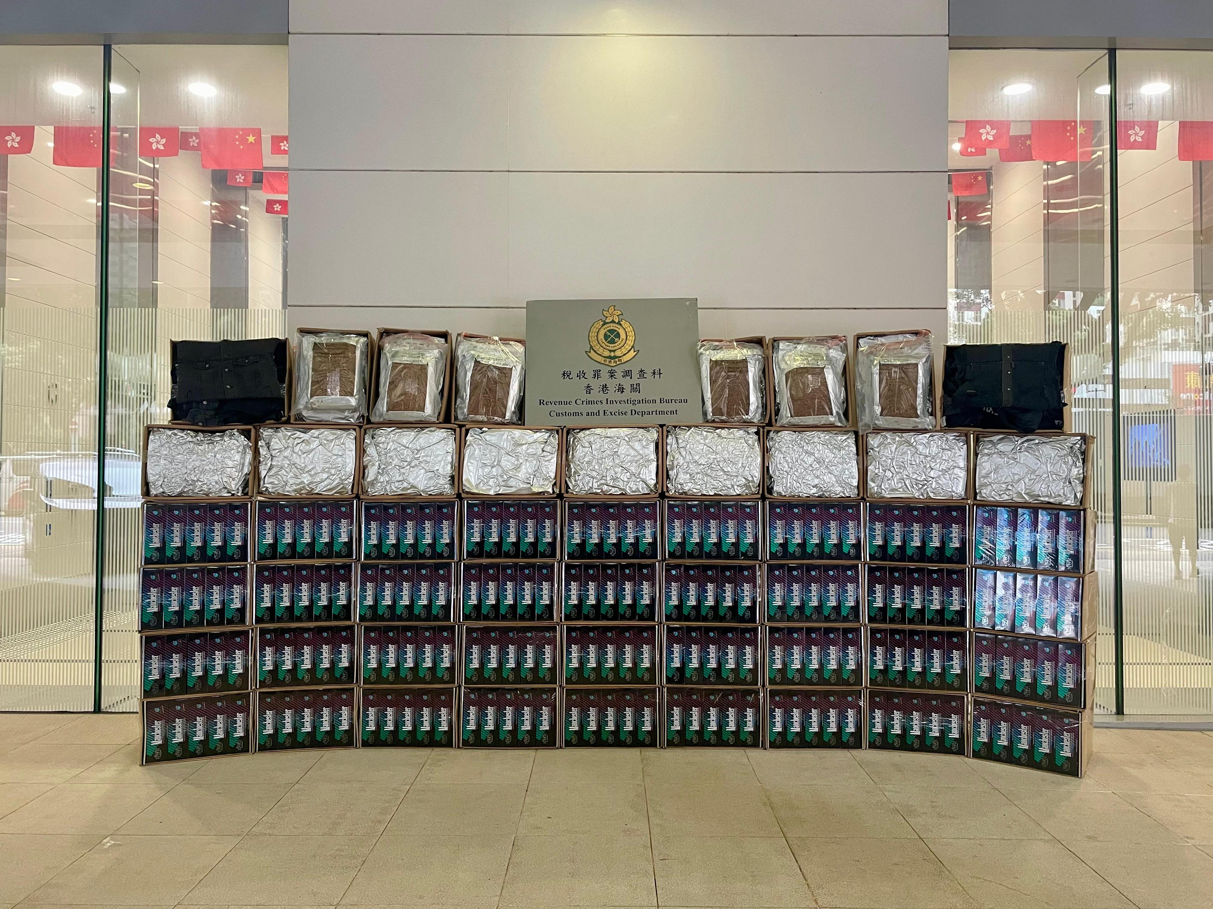 Hong Kong Customs yesterday (August 20) raided three suspected illicit tobacco products centres in the New Territories. A total of about 410 000 suspected illicit cigarettes and about 2 200 kilograms of suspected duty-not-paid manufactured tobacco, with an estimated market value of about $17 million and a duty potential of about $10 million, were seized. Photo shows some of the suspected tobacco products seized.