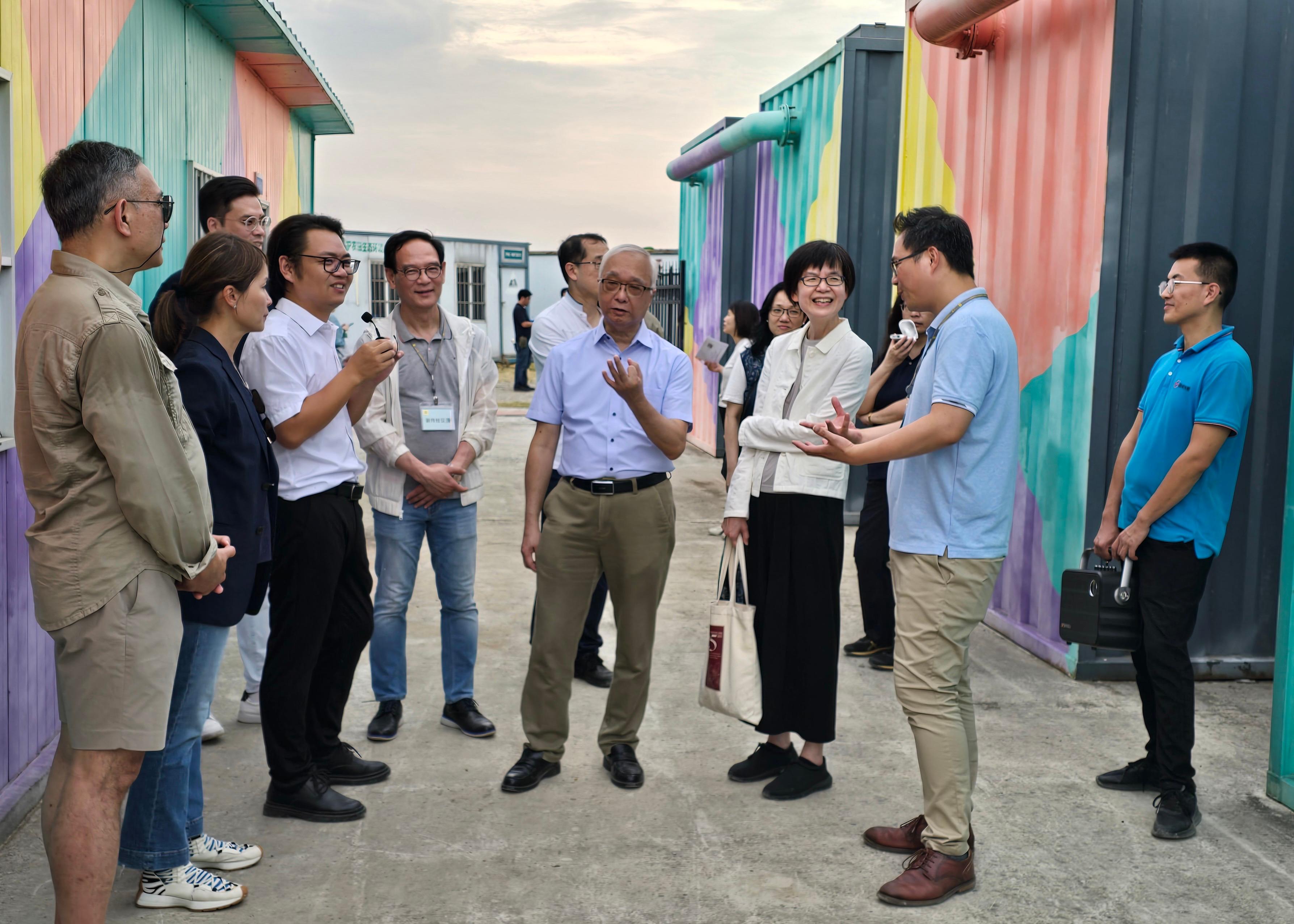 The Secretary for Environment and Ecology, Mr Tse Chin-wan, together with the Legislative Council Panel on Food Safety and Environmental Hygiene, visited the modern fisheries farming facilities and systems at an aquaculture enterprise in Nanjing today (August 23). Photo shows Mr Tse (fourth right); the Chairman of the Panel, Mr Yang Wing-kit (second right); the Permanent Secretary for Environment and Ecology (Food), Miss Vivian Lau (third right), and members of the delegation being briefed by a staff member on their water treatment system.