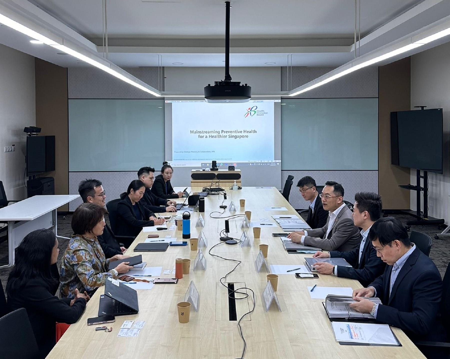 The Director of Health, Dr Ronald Lam, led a delegation from the Centre for Health Protection (CHP) of the Department of Health to Singapore and started a three-day visit on August 22. Photo shows Dr Lam (third right) and the Controller of the CHP, Dr Edwin Tsui (second right), visiting the Health Promotion Board of Singapore to discuss strategies and experiences in health promotion, including cross sector collaborations and harnessing information and technology to support health promotion efforts.