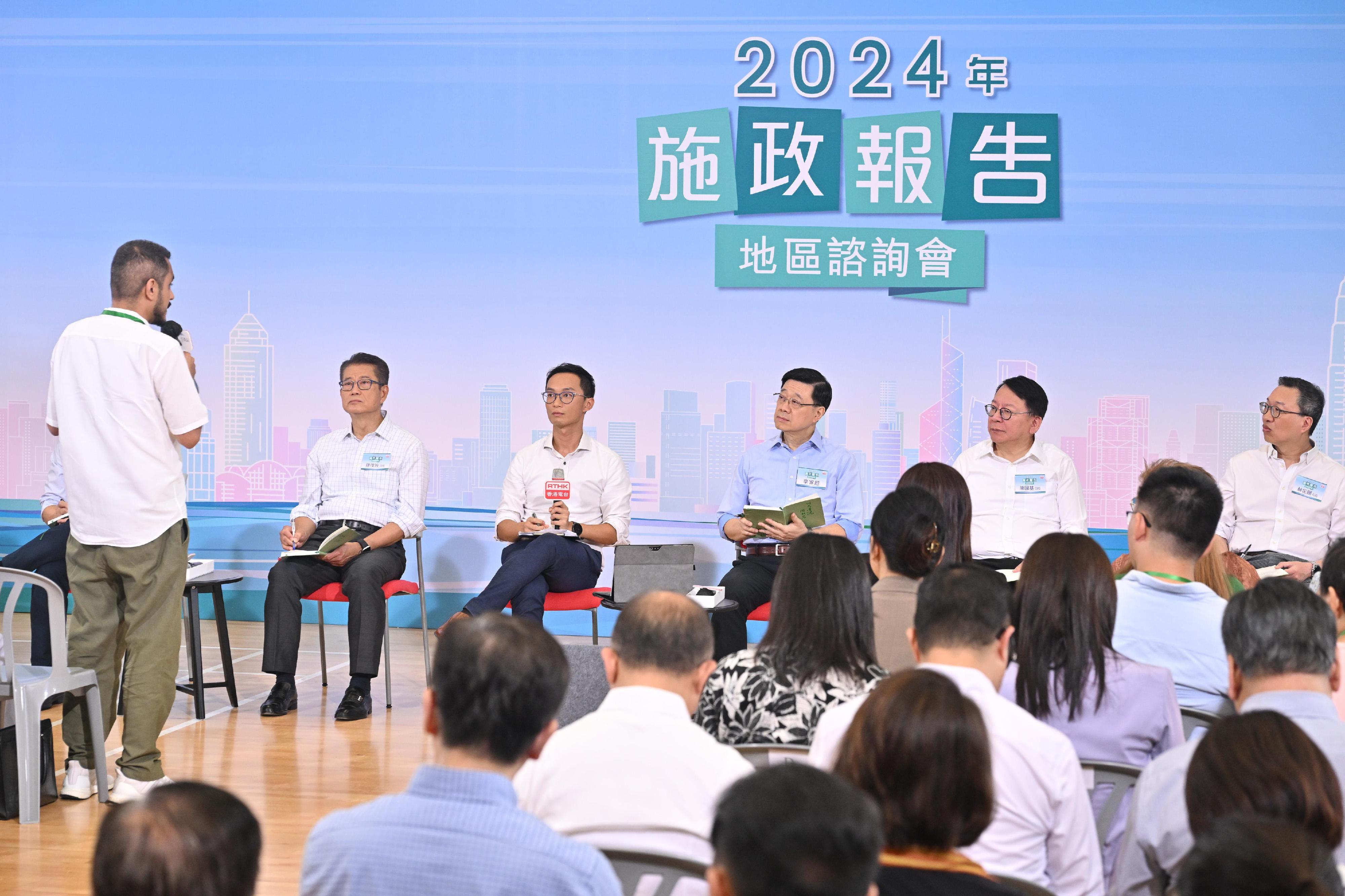 The Chief Executive, Mr John Lee, attended the second 2024 Policy Address District Forum with some Principal Officials this morning (August 25) to listen to views and suggestions of local community members on the upcoming Policy Address. Photo shows Mr Lee (centre); the Chief Secretary for Administration, Mr Chan Kwok-ki (second right); the Financial Secretary, Mr Paul Chan (first left); and the Secretary for Justice, Mr Paul Lam, SC (first right), listening to views of the public at the consultation session.