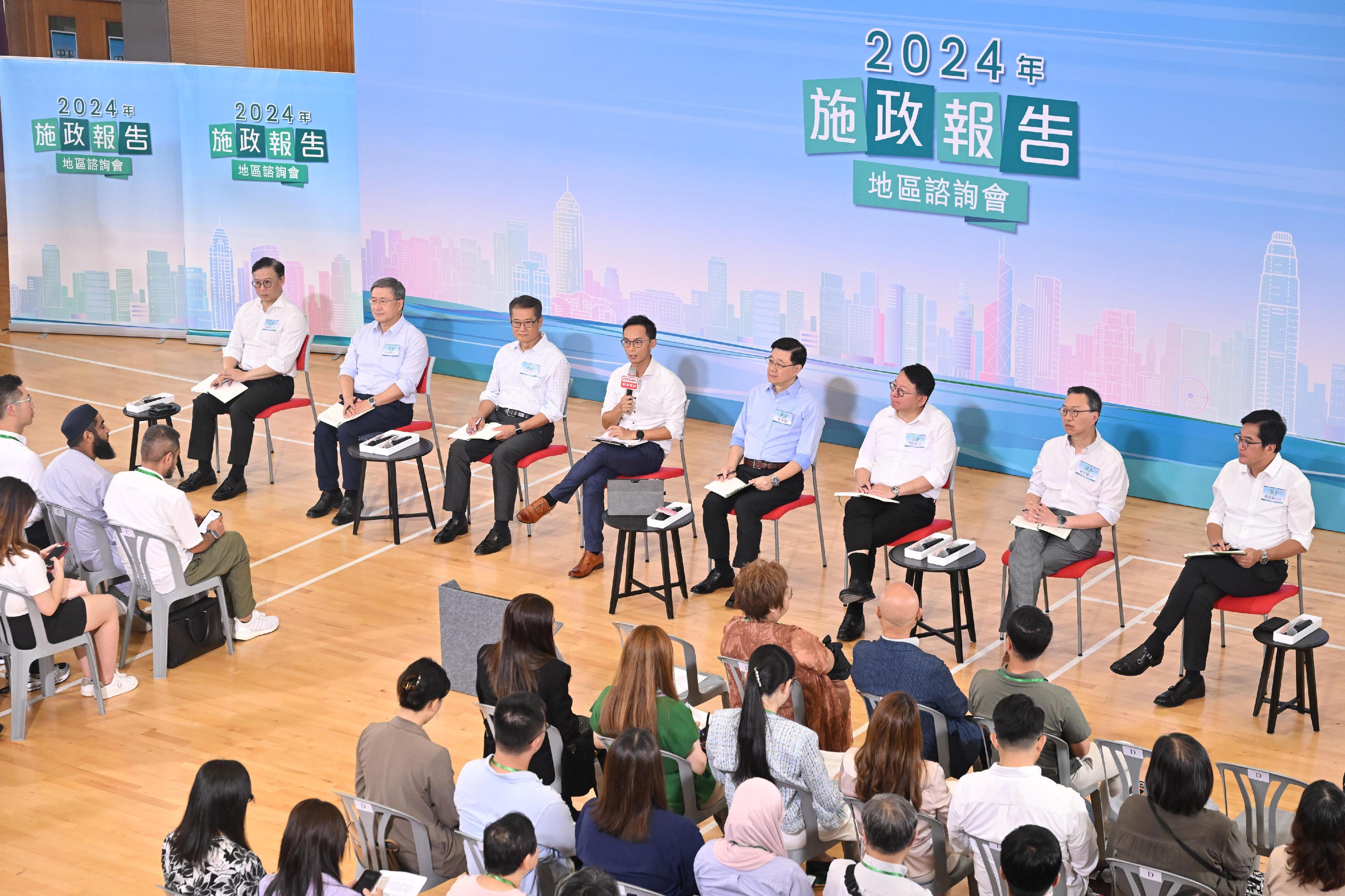 The Chief Executive, Mr John Lee, attended the second 2024 Policy Address District Forum with some Principal Officials this morning (August 25) to listen to views and suggestions of local community members on the upcoming Policy Address. Photo shows Mr Lee (fourth right); the Chief Secretary for Administration, Mr Chan Kwok-ki (third right); the Financial Secretary, Mr Paul Chan (third left); the Secretary for Justice, Mr Paul Lam, SC (second right); the Deputy Chief Secretary for Administration, Mr Cheuk Wing-hing (second left); the Deputy Financial Secretary, Mr Michael Wong (first right); and the Deputy Secretary for Justice, Mr Cheung Kwok-kwan (first left), listening to views of the public at the consultation session.