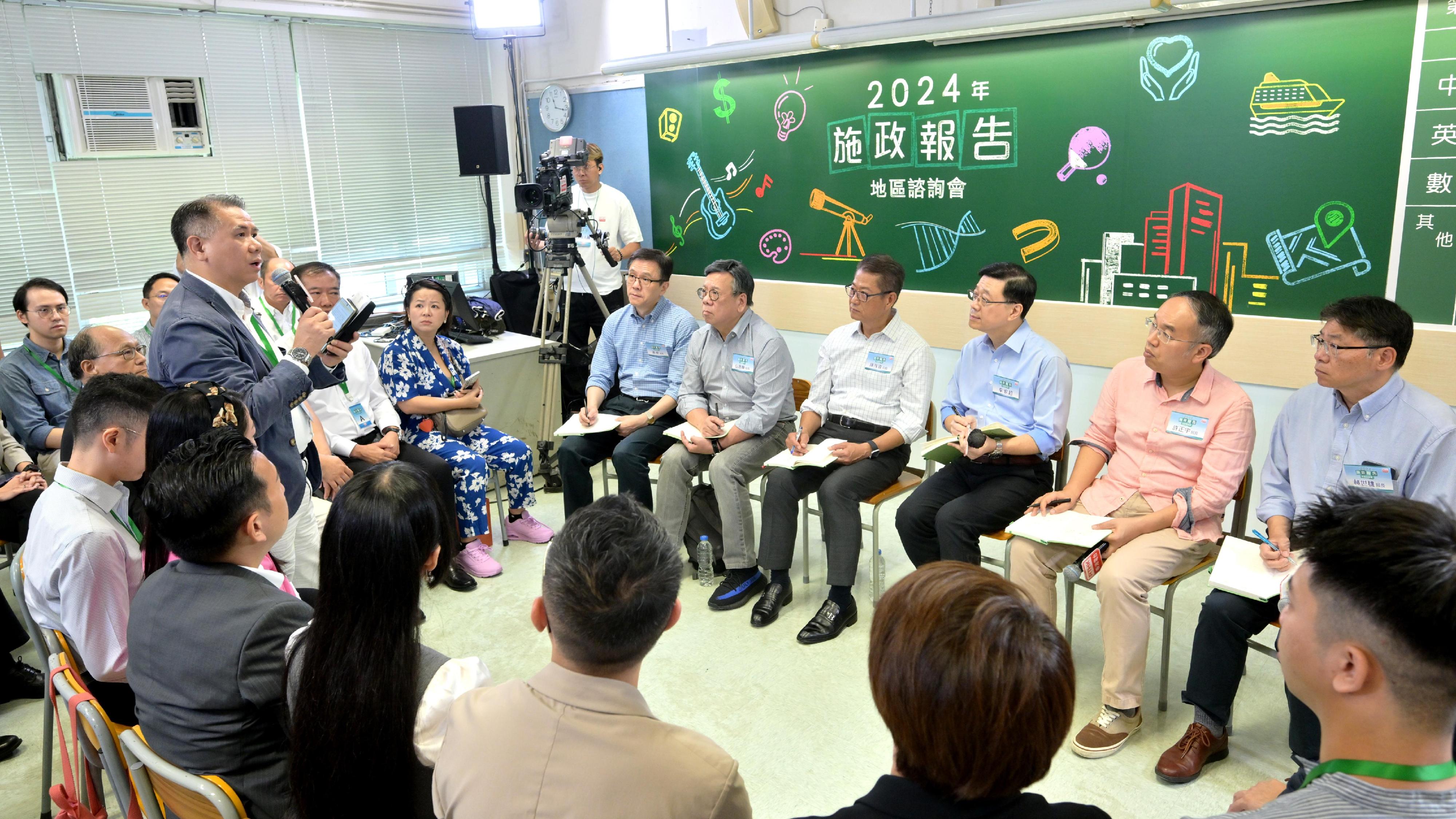 The Chief Executive, Mr John Lee, attended the second 2024 Policy Address District Forum with some Principal Officials this morning (August 25) to listen to views and suggestions of local community members on the upcoming Policy Address. Photo shows (from left) the Secretary for Innovation, Technology and Industry, Professor Sun Dong; the Secretary for Commerce and Economic Development, Mr Algernon Yau; the Financial Secretary, Mr Paul Chan; Mr Lee; the Secretary for Financial Services and the Treasury, Mr Christopher Hui; and the Secretary for Transport and Logistics, Mr Lam Sai-hung, listening to views of the public at the consultation session.