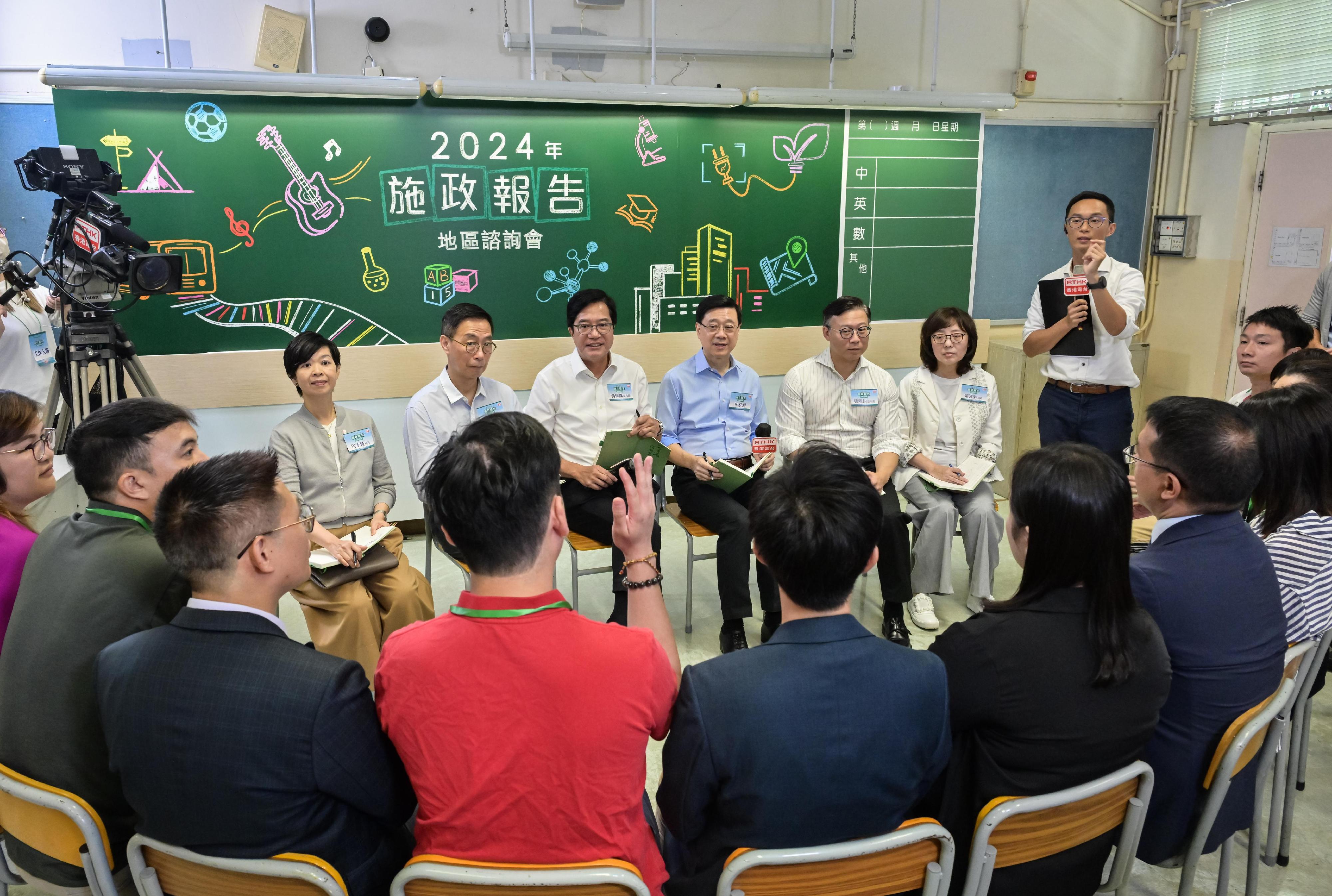 The Chief Executive, Mr John Lee, attended the second 2024 Policy Address District Forum with some Principal Officials this morning (August 25) to listen to views and suggestions of local community members on the upcoming Policy Address. Photo shows (from left) the Secretary for Housing, Ms Winnie Ho; the Secretary for Culture, Sports and Tourism, Mr Kevin Yeung; the Deputy Financial Secretary, Mr Michael Wong; Mr Lee; the Deputy Secretary for Justice, Mr Cheung Kwok-kwan; and the Secretary for Development, Ms Bernadette Linn, listening to views of the public at the consultation session.