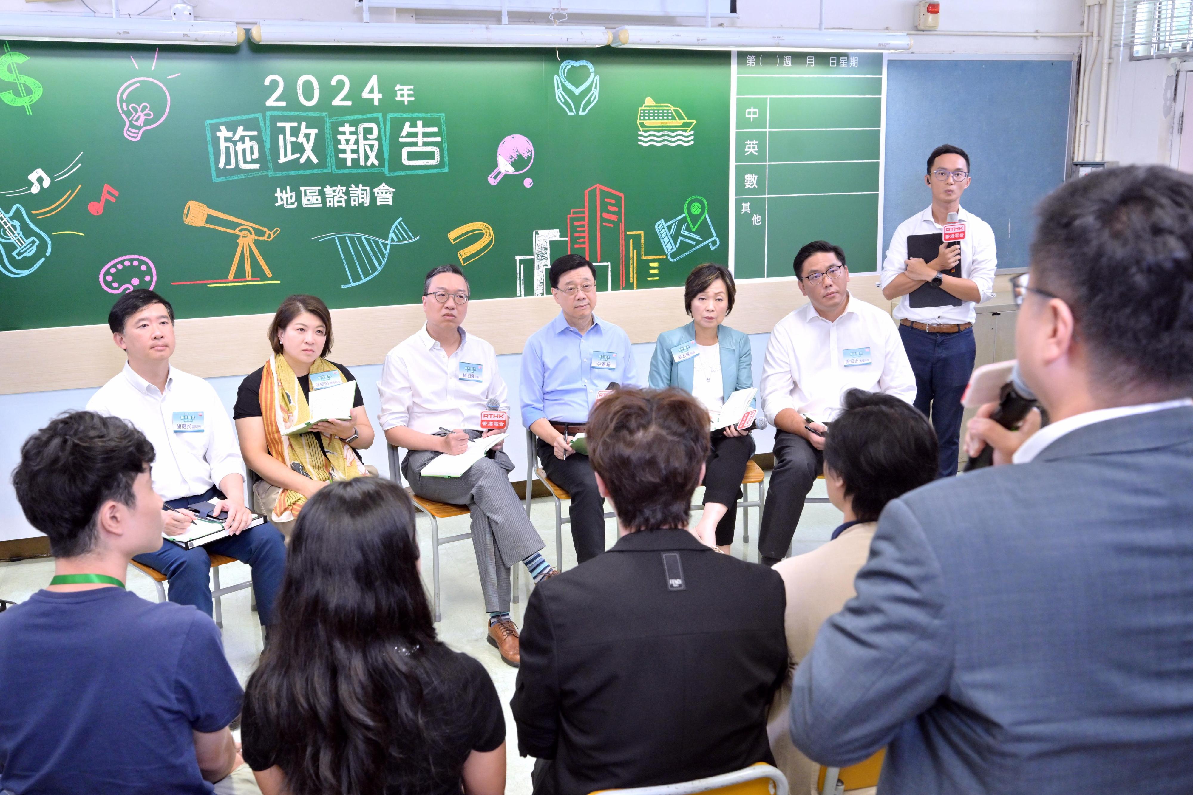 The Chief Executive, Mr John Lee, attended the second 2024 Policy Address District Forum with some Principal Officials this morning (August 25) to listen to views and suggestions of local community members on the upcoming Policy Address. Photo shows (from left) the Under Secretary for Constitutional and Mainland Affairs, Mr Clement Woo; the Acting Secretary for Health, Dr Libby Lee; the Secretary for Justice, Mr Paul Lam, SC; Mr Lee; the Secretary for Education, Dr Choi Yuk-lin; and the Acting Secretary for Home and Youth Affairs, Mr Clarence Leung, listening to views of the public at the consultation session.