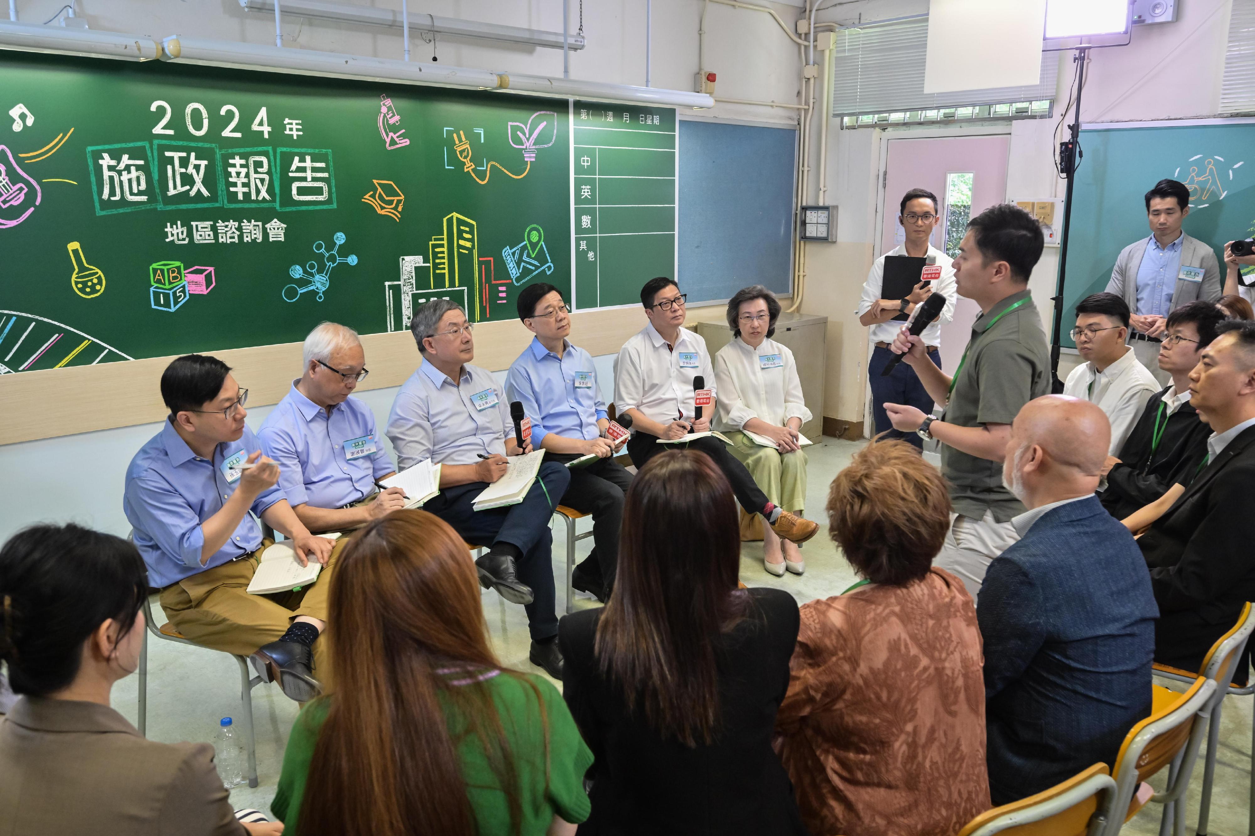 The Chief Executive, Mr John Lee, attended the second 2024 Policy Address District Forum with some Principal Officials this morning (August 25) to listen to views and suggestions of local community members on the upcoming Policy Address. Photo shows (from left) the Secretary for Labour and Welfare, Mr Chris Sun; the Secretary for Environment and Ecology, Mr Tse Chin-wan; the Deputy Chief Secretary for Administration, Mr Cheuk Wing-hing; Mr Lee; the Secretary for Security, Mr Tang Ping-keung; and the Secretary for the Civil Service, Mrs Ingrid Yeung, listening to views of the public at the consultation session.