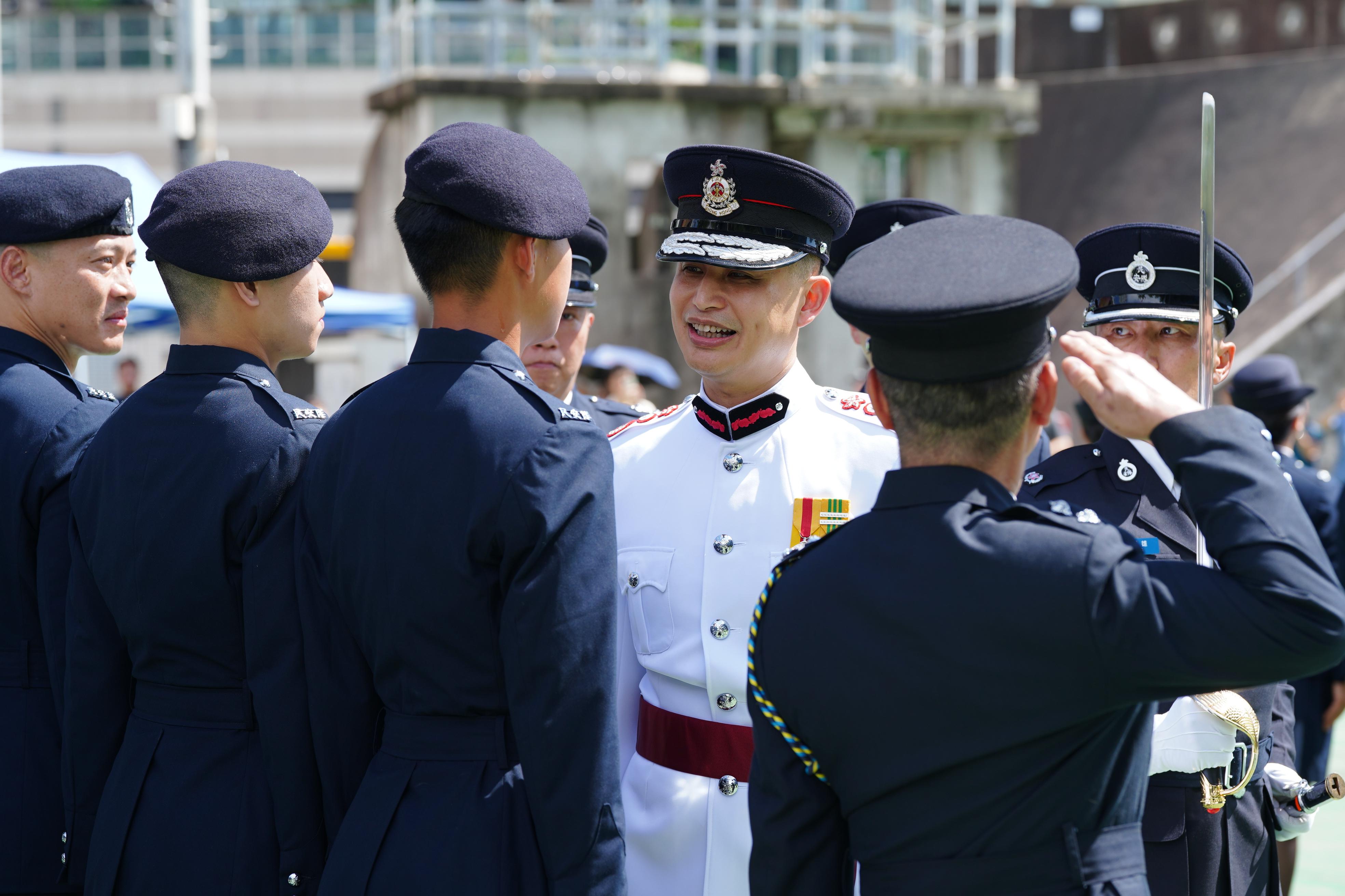 The Civil Aid Service held the 88th Recruits Passing-out Parade at its headquarters today (August 25). Photo shows the Director of Fire Services, Mr Andy Yeung (third right), inspecting the parade.