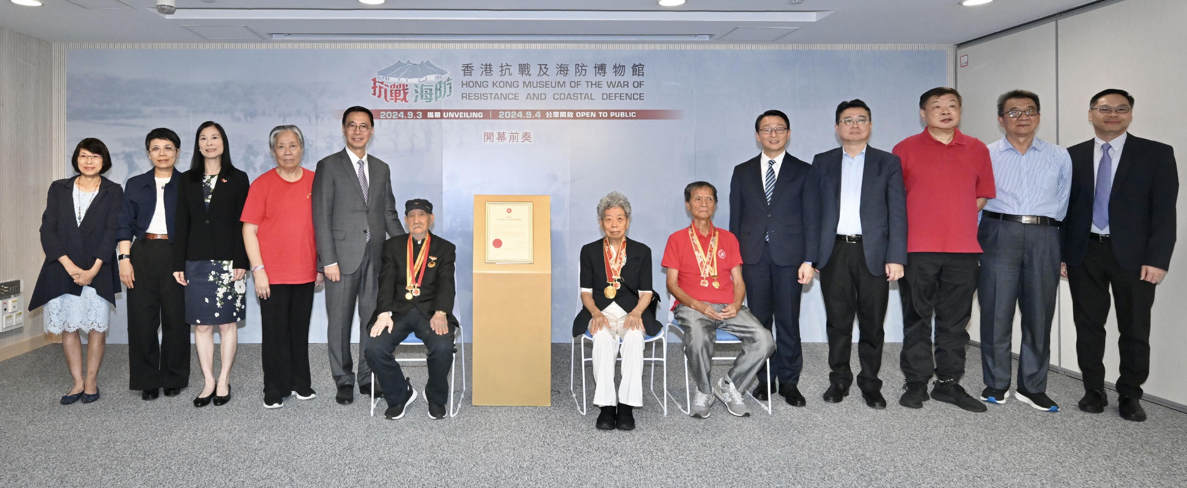 The Hong Kong Museum of Coastal Defence today (August 27) held a prelude to the opening of the Hong Kong Museum of the War of Resistance and Coastal Defence. Photo shows (from left) the Assistant Director (Heritage and Museums) of the Leisure and Cultural Services Department, Ms Esa Leung; the Deputy Director of Leisure and Cultural Services (Culture), Miss Eve Tam; Legislative Council Member Ms Maggie Chan; the Chairman of the East River Column History Research Association, Ms Wan Siu-ping; the Secretary for Culture, Sports and Tourism, Mr Kevin Yeung; veteran Mr Li Bin; the President of the Society of Veterans of the Original Hong Kong Independent Battalion of the Dongjiang Column, Ms Lam Chun and the Director, Mr Tse Cheung-hing; the Director of Leisure and Cultural Services, Mr Vincent Liu; the Chief Editor of Hong Kong Chronicles Institute, Professor Lau Chi-pang; the Vice President of the Society of Veterans of the Original Hong Kong Independent Battalion of the Dongjiang Column, Mr Lam Ming; the Chairman of the Hong Kong War History Research Association, Mr Wu Junjie; and the Museum Director of the Hong Kong Museum of History, Mr Terence Cheung.