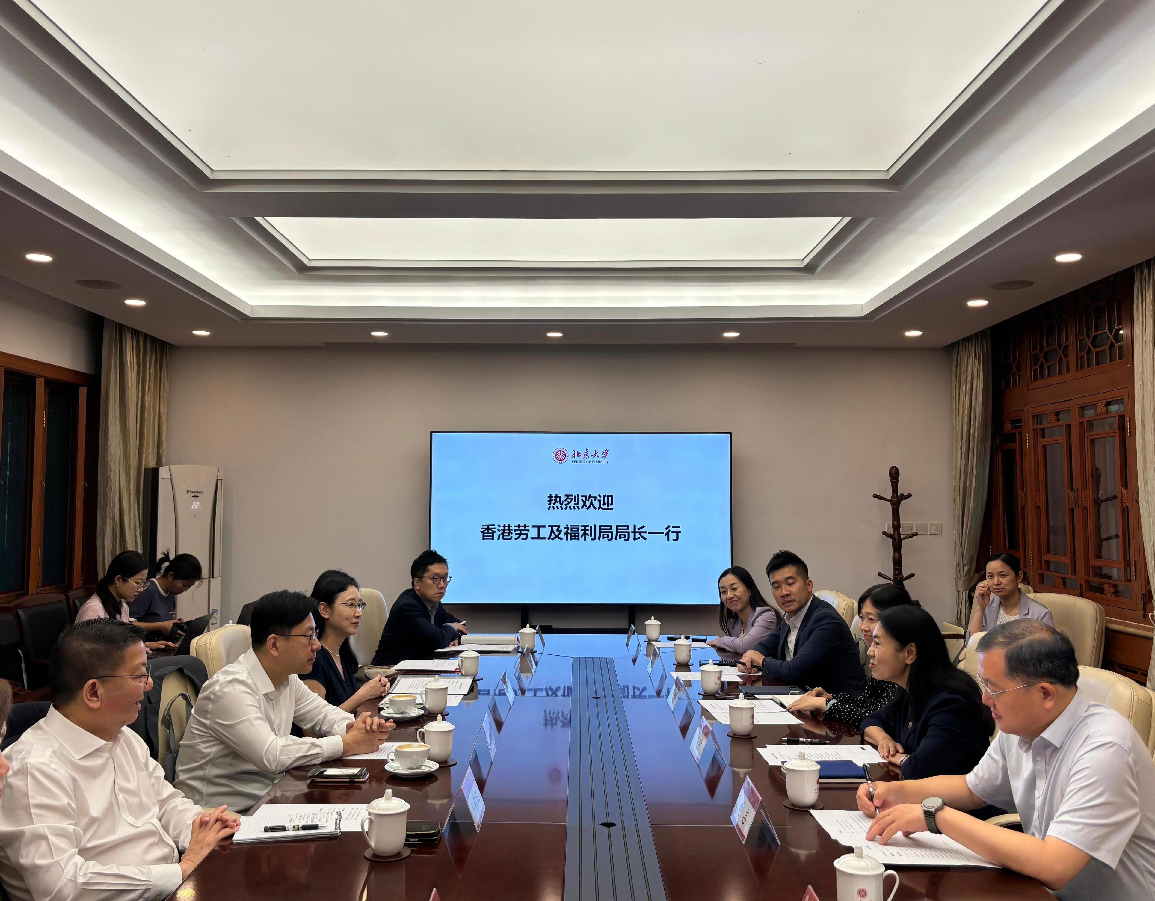 The Secretary for Labour and Welfare, Mr Chris Sun, concluded his Beijing visit today (August 28). The Permanent Secretary for Labour and Welfare, Ms Alice Lau, also joined the visit. Photo shows Mr Sun (second left) meeting with the Deputy Secretary of the Peking University Party Committee and Vice President of Peking University, Professor Ning Qi (second right), today to introduce the Hong Kong Special Adminstrative Region Government's talent attraction measures. Looking on is Ms Lau (third left).