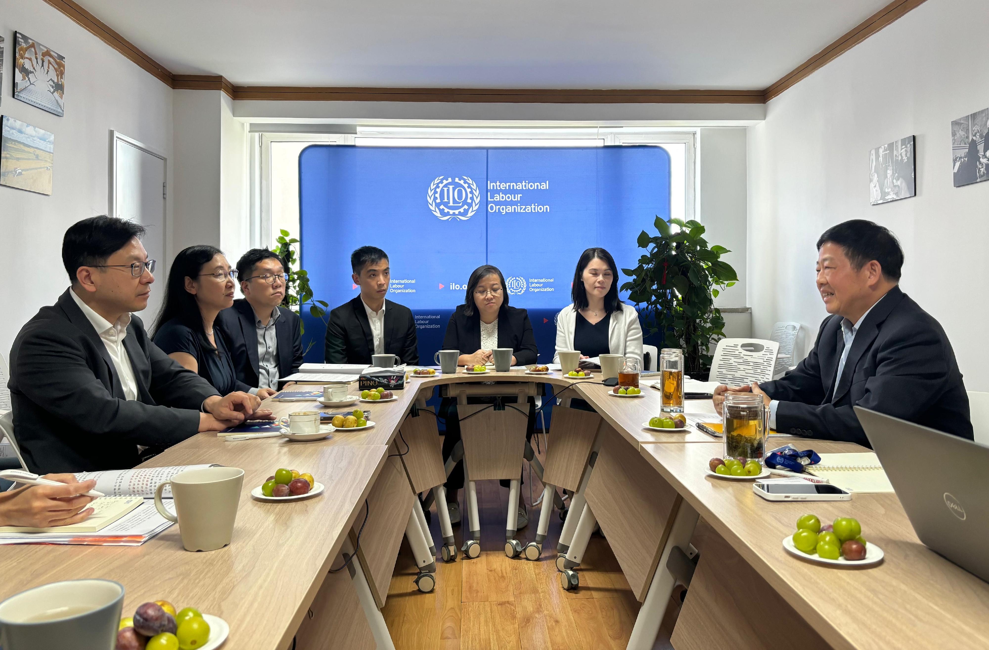 The Secretary for Labour and Welfare, Mr Chris Sun, concluded his Beijing visit today (August 28). The Permanent Secretary for Labour and Welfare, Ms Alice Lau, also joined the visit. Photo shows Mr Sun (first left) meeting with the Deputy Director of the International Labour Organization Country Office for China and Mongolia, Mr Dai Xiaochu (first right), today to exchange views on various labour matters. Looking on is Ms Lau (second left).