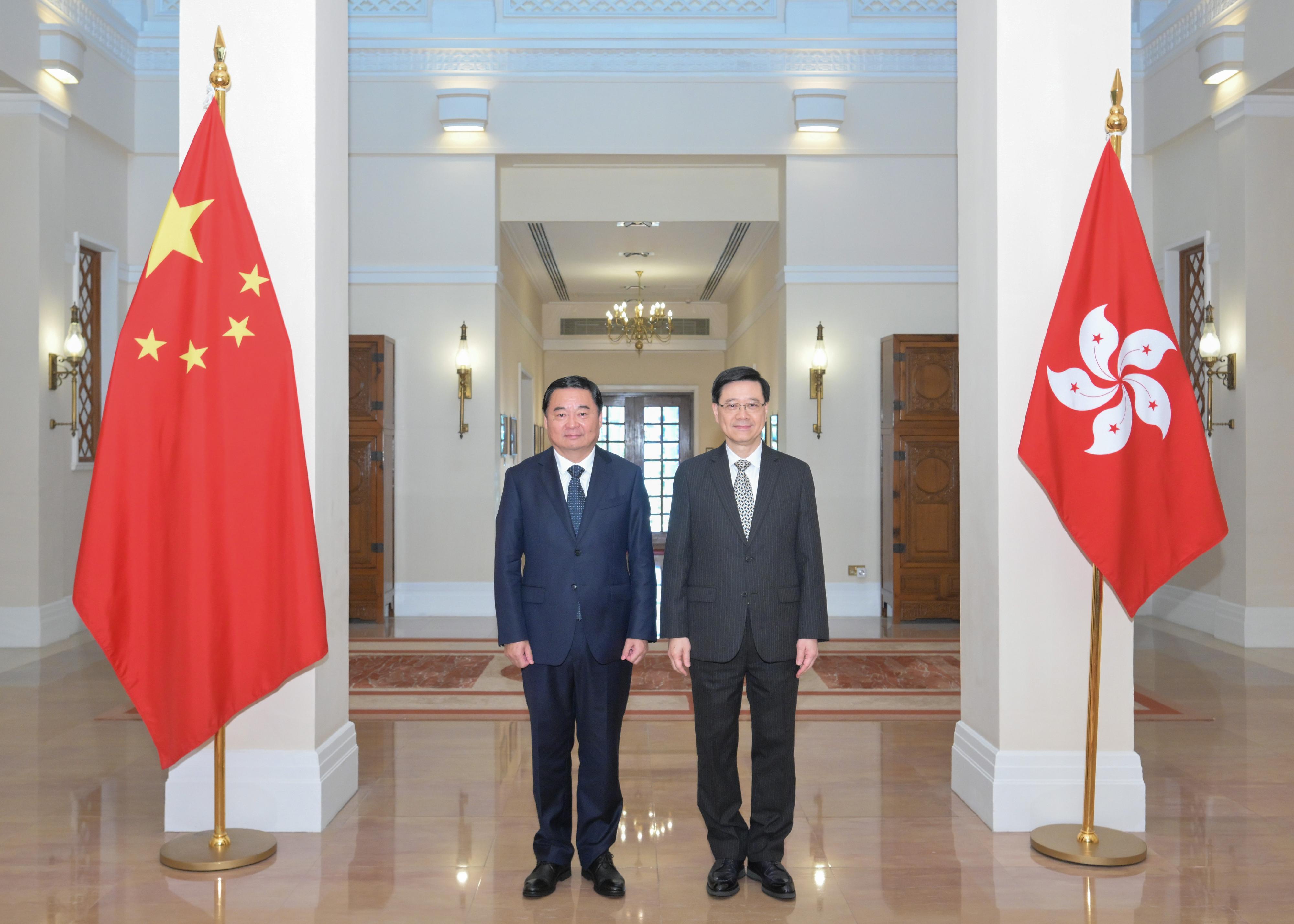 The Chief Executive, Mr John Lee (right), meets the Secretary of the CPC Liaoning Provincial Committee, Mr Hao Peng (left), at Government House today (August 28). 