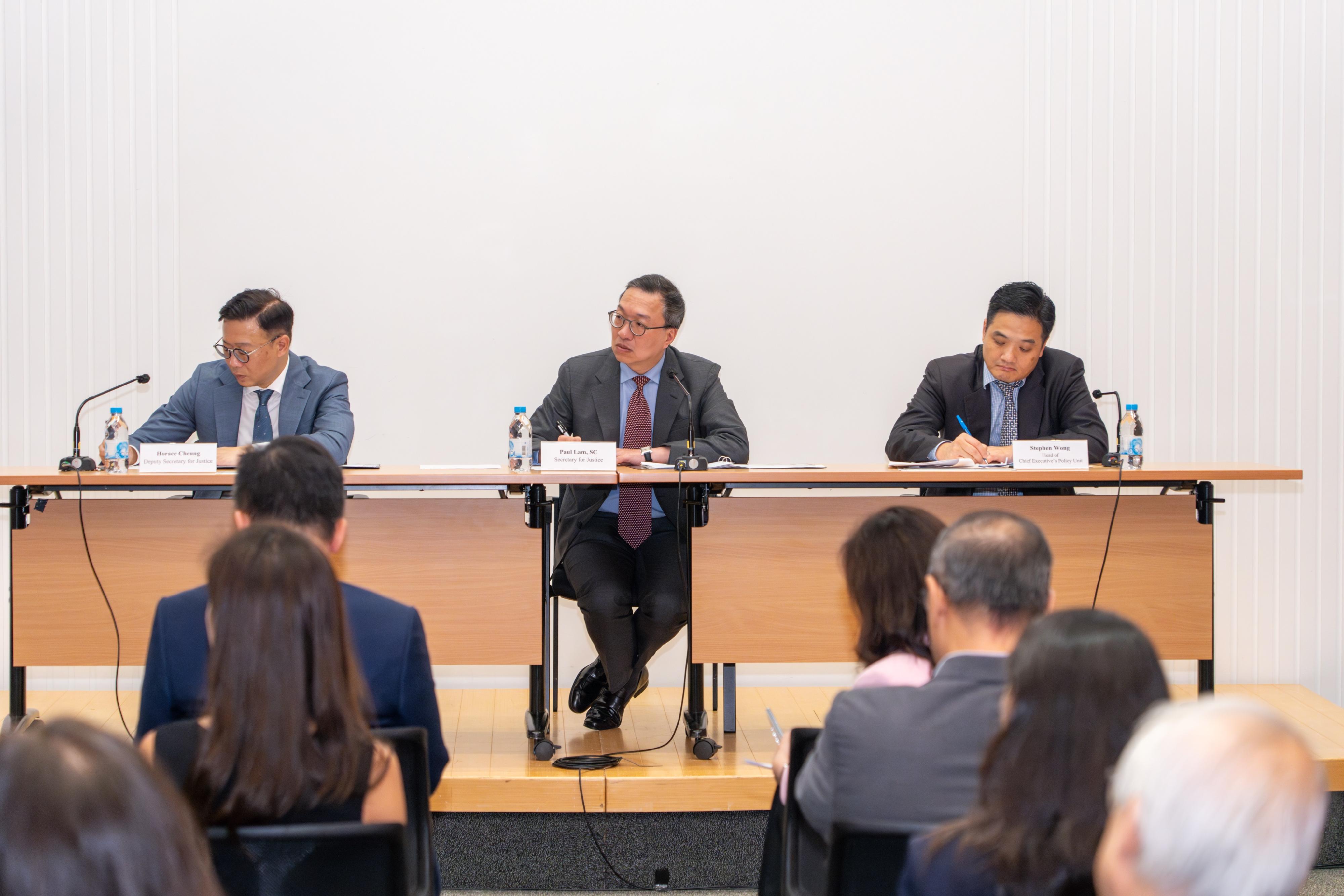 The Department of Justice held a 2024 Policy Address consultation session entitled "International Legal and Dispute Resolution Services Centre" today (August 29) at Justice Place. Photo shows the Secretary for Justice, Mr Paul Lam, SC (centre); the Deputy Secretary for Justice, Mr Cheung Kwok-kwan (left); and the Head of the Chief Executive's Policy Unit, Dr Stephen Wong (right), listening to the views and suggestions from the legal and dispute resolution sectors on the upcoming Policy Address at the session.