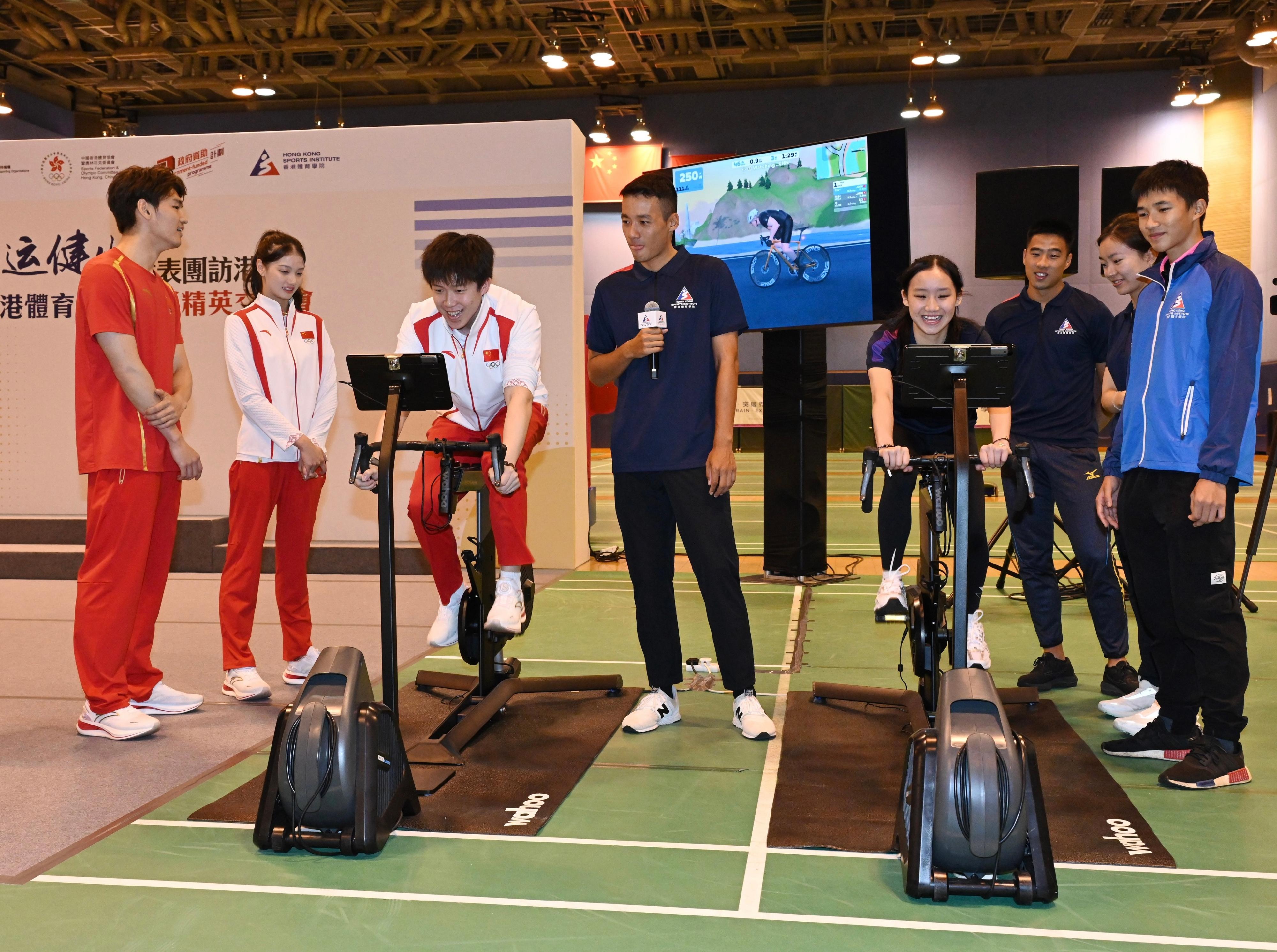 The 2024 Paris Olympic Games Mainland Olympians delegation continued their visit to Hong Kong today (August 30). Photo shows members of the delegation visiting the Hong Kong Sports Institute and interacting with local elite athletes.