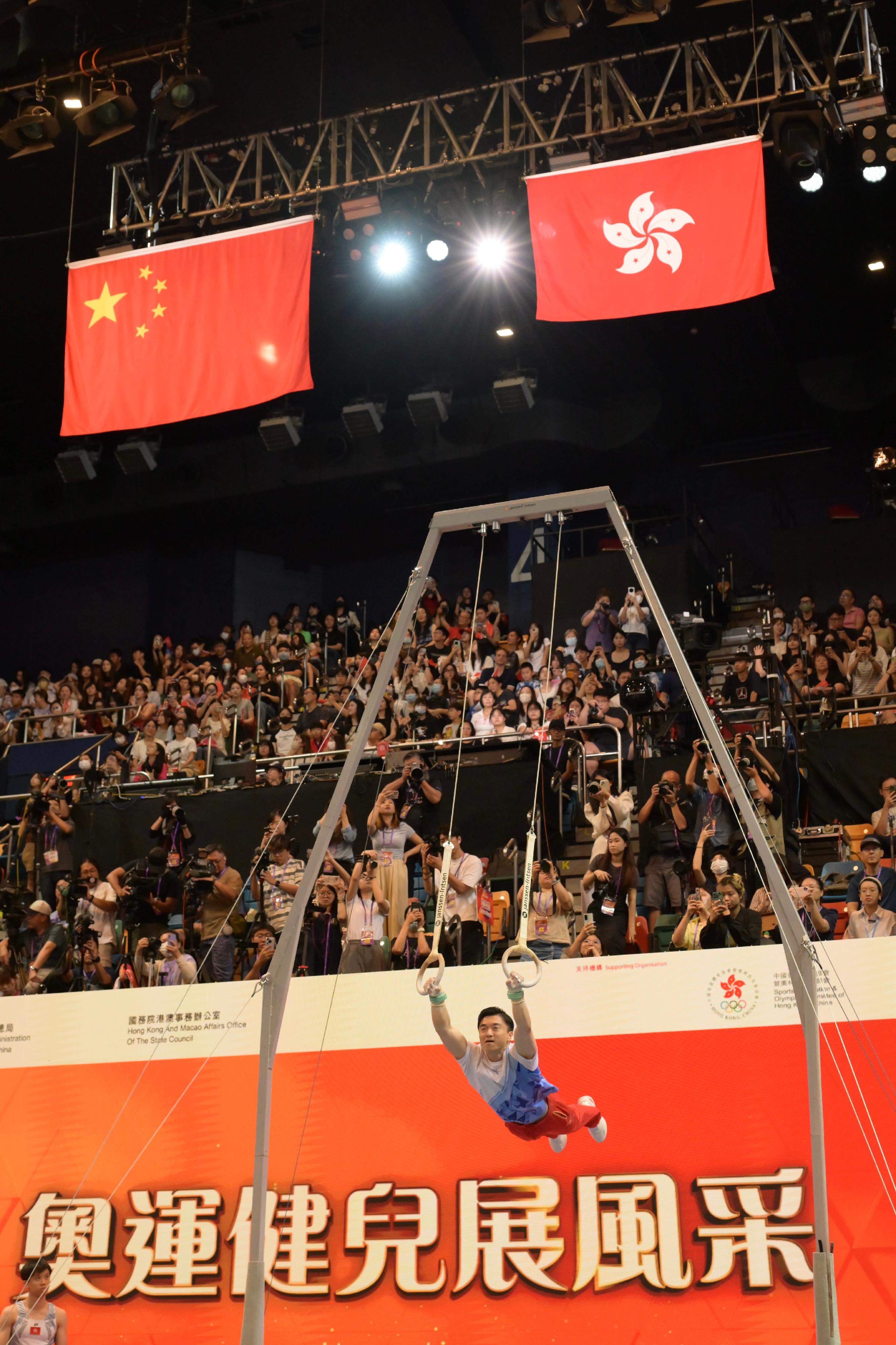 The 2024 Paris Olympic Games Mainland Olympians delegation attended the Sports Demonstrations by Mainland Olympians at Queen Elizabeth Stadium in Wan Chai this morning (August 31). Photo shows the gymnastics athlete of the national team, Liu Yang performing a rings demonstration.