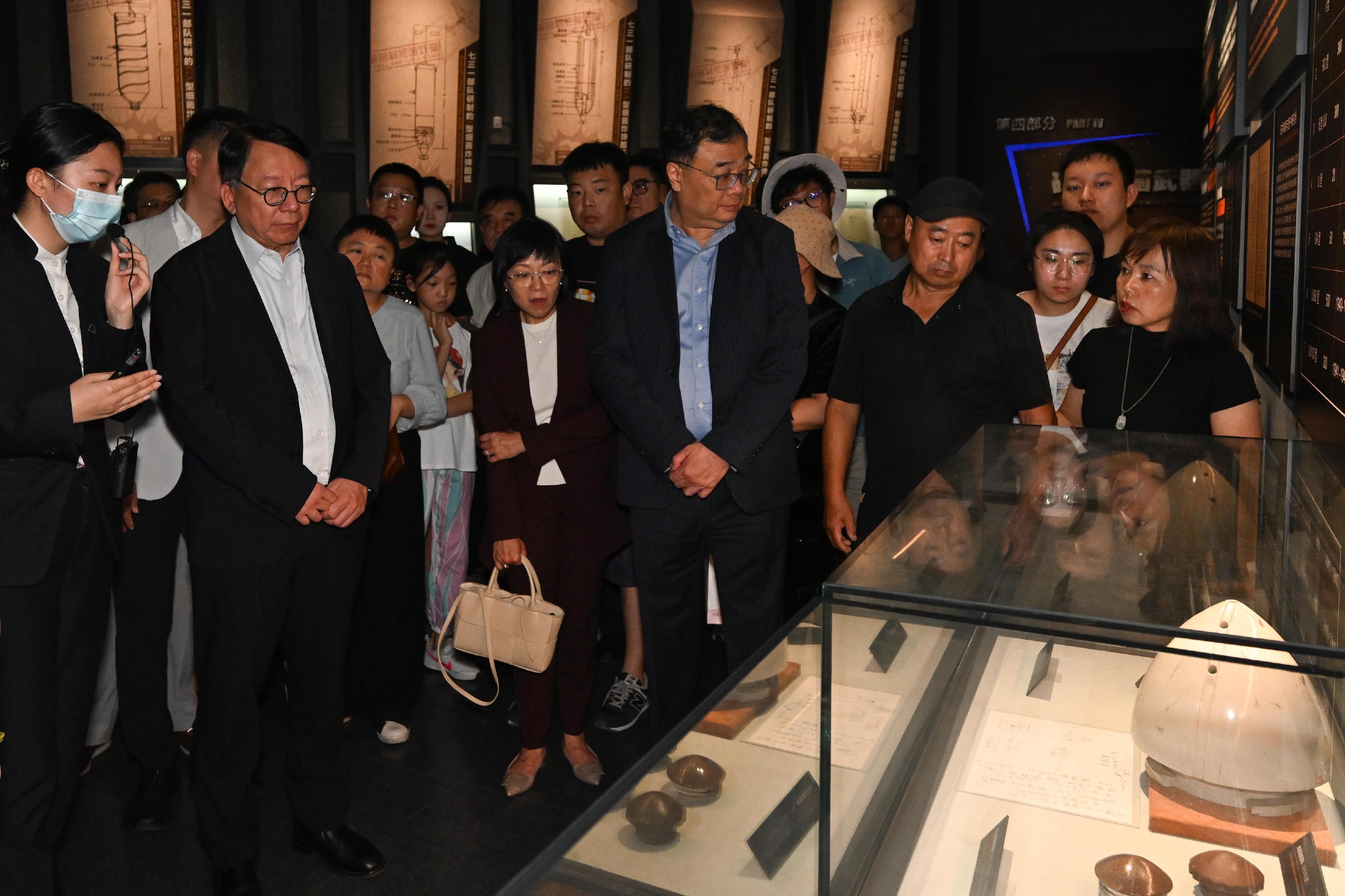 The Chief Secretary for Administration, Mr Chan Kwok-ki, continued his visit to Harbin today (August 31). Photo shows Mr Chan (front row, second left) visiting the Exhibition Hall of Evidences of Crime Committed by Unit 731 of the Japanese Imperial Army and being briefed by a staff member.