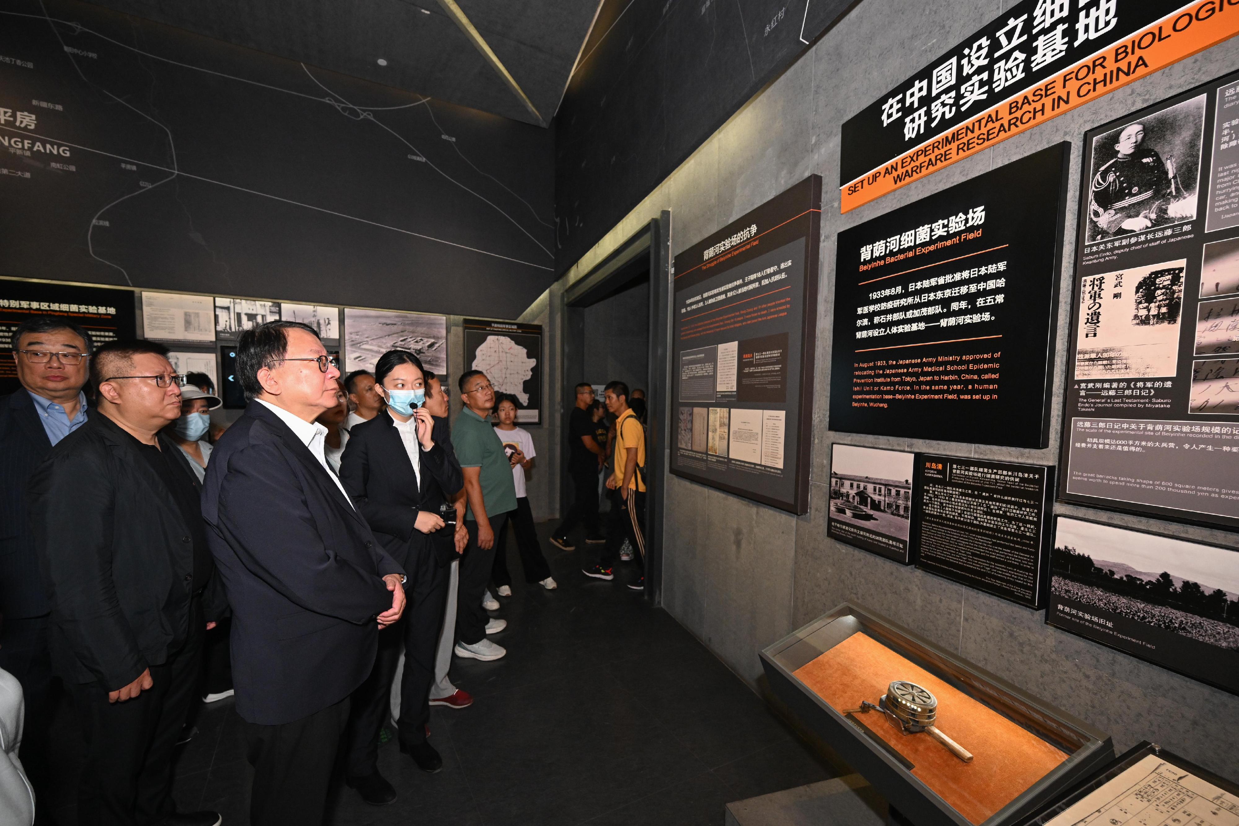 The Chief Secretary for Administration, Mr Chan Kwok-ki, continued his visit to Harbin today (August 31). Photo shows Mr Chan (third left) visiting the Exhibition Hall of Evidences of Crime Committed by Unit 731 of the Japanese Imperial Army and being briefed by a staff member.