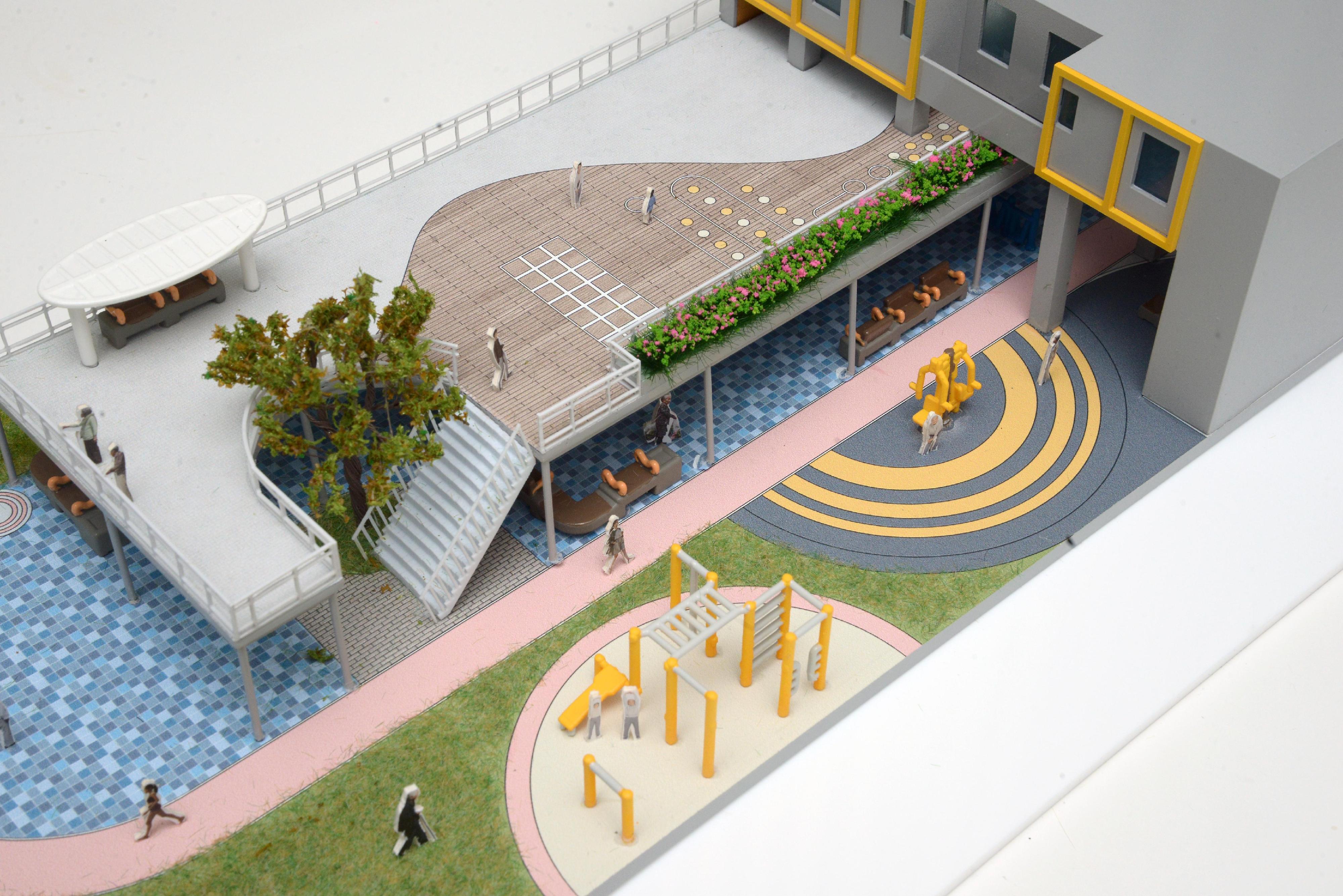 The Housing Bureau and the Hong Kong Housing Authority today (September 2) announced the launch of a resident-oriented "Well-being design" guide, which will serve as a reference for the future design of new public housing estates and the improvement works of existing estates. Photo shows the model  "Communal Fitness Playscape", with jogging track, fitness equipment, playground, lawn and benches that can be flexibly arranged to suit residents' needs to build a green living space that promotes "Health & Vitality", "Intergenerational & Inclusive Living" and "Family & Community Connection".