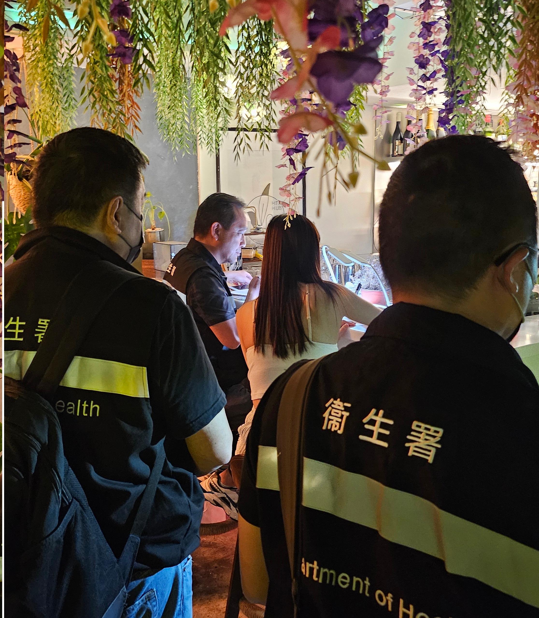 The Tobacco and Alcohol Control Office (TACO) of the Department of Health conducted an enforcement operation against illegal waterpipe smoking activities in no smoking areas in Central District last night (September 3). Photo shows officers from TACO taking enforcement action inside a bar.