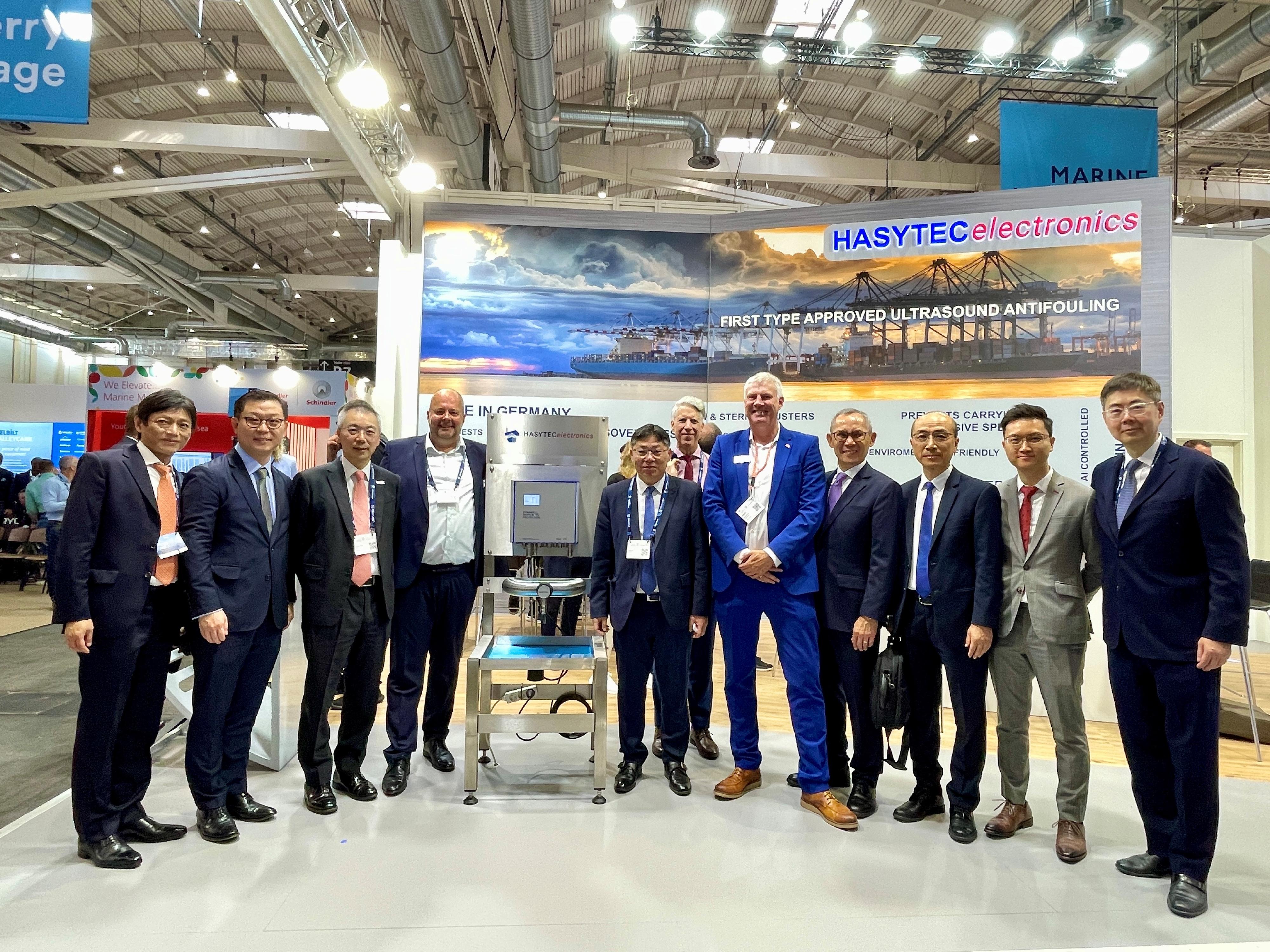 The Secretary for Transport and Logistics, Mr Lam Sai-hung, who is also the Chairman of the Hong Kong Maritime and Port Board (HKMPB), continued his visit to Hamburg, Germany, with a delegation of HKMPB members. Photo shows Mr Lam (fifth left), Deputy Director of Marine Mr Shi Qiang (third right) and some exhibitors at the Shipbuilding, Machinery and Marine Technology (SMM) trade fair 2024 in Hamburg on September 4 (Hamburg time).