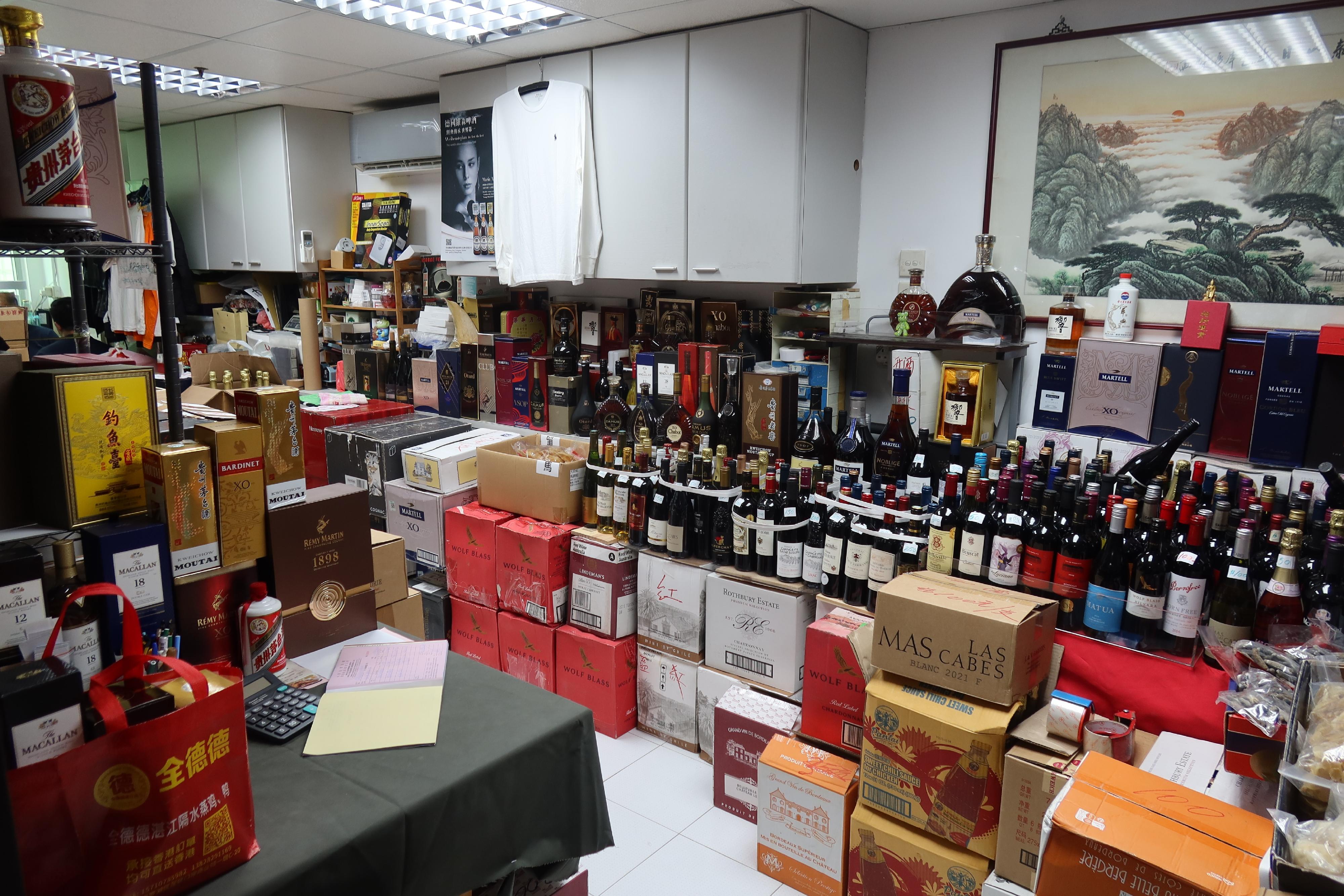 Hong Kong Customs on August 27 mounted a special enforcement operation in Kwai Chung to combat the sale of counterfeit liquor. A total of about 1 300 bottles of suspected counterfeit liquor, with an estimated market value of about $2.9 million, were seized. Photo shows the business premises that sold suspected counterfeit liquor raided by Customs officers. 