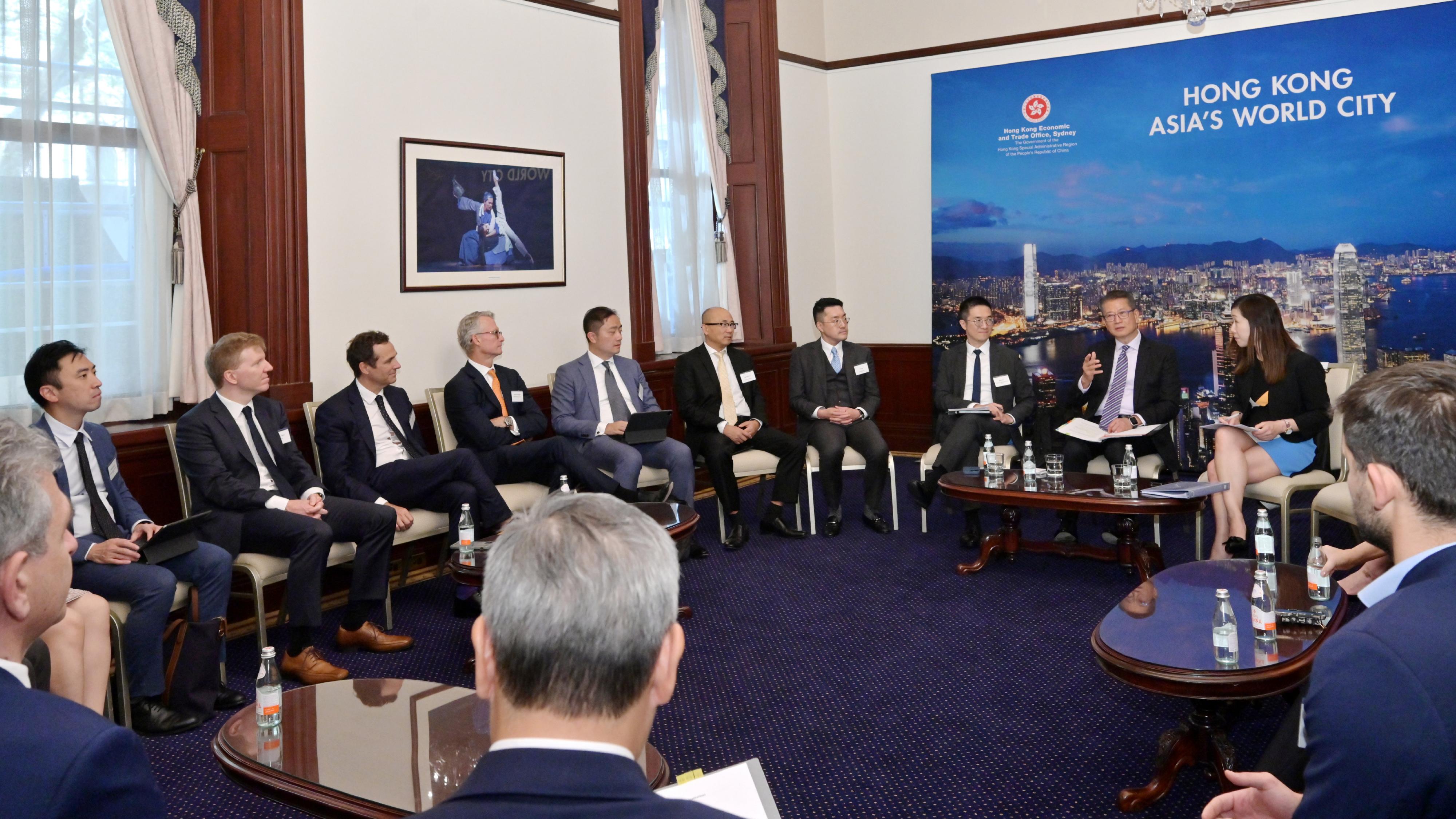 The Financial Secretary, Mr Paul Chan, continued his visit to Sydney, Australia, today (September 5, Sydney time). Photo shows Mr Chan (second right) having a roundtable discussion with senior staff of over 10 financial institutions at the Hong Kong Economic and Trade Office, Sydney.