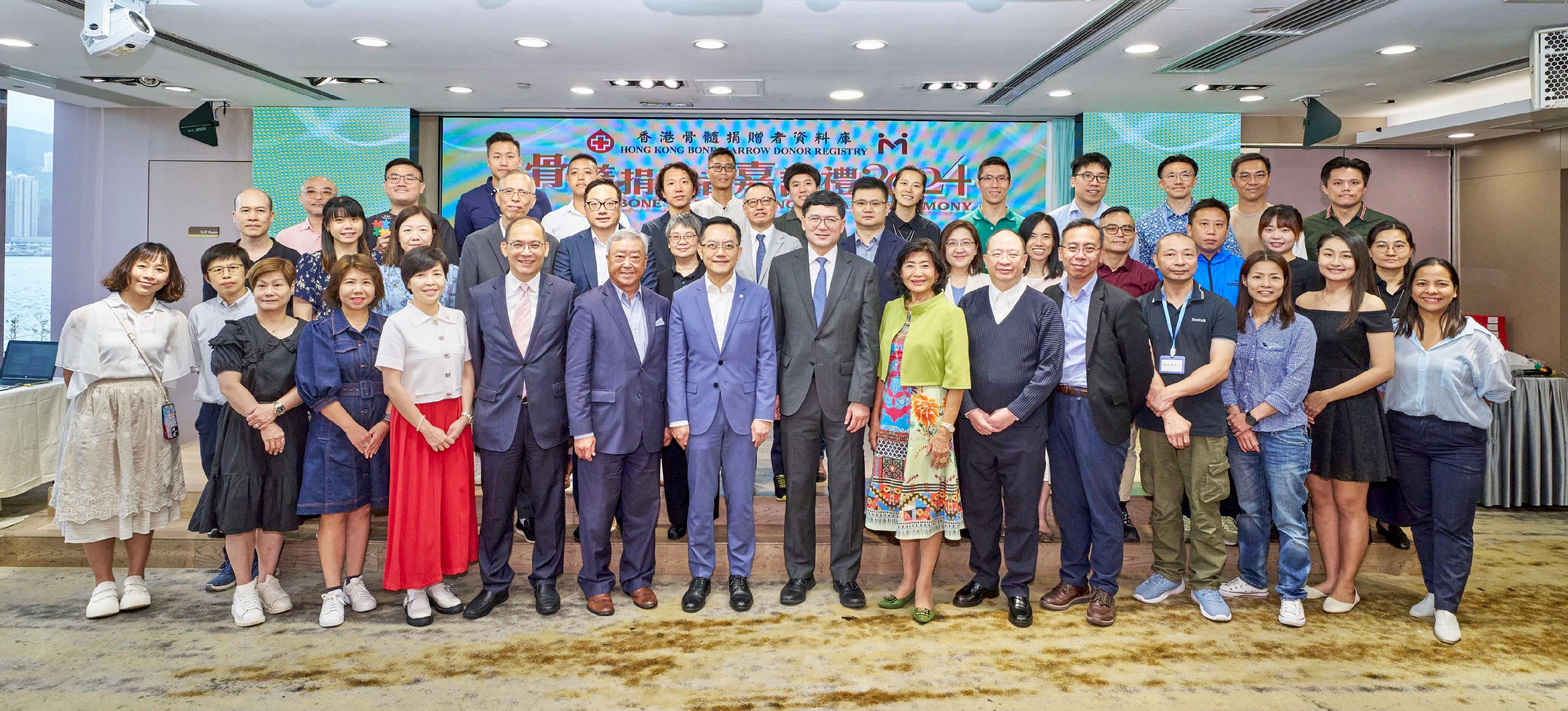 The Bone Marrow Donor Award Ceremony 2024 organised by the Hong Kong Bone Marrow Donor Registry of the Hong Kong Red Cross Blood Transfusion Service was held today (September 7), recognising 38 dedicated bone marrow donors for their selfless contributions. Photo shows the Director of Health, Dr Ronald Lam (front row, seventh left); the Chairman of Hong Kong Red Cross Blood Transfusion Service Governing Committee and the Hong Kong Bone Marrow Donor Registry Governing Sub-committee, Mr Ignatius Chan (front row, sixth left); the President of Hong Kong Marrow Match Foundation, Professor Alice Chiu (front row, seventh right); the Chief Executive of Hospital Authority, Dr Tony Ko (front row, eighth right) and the Chief Executive and Medical Director of the BTS, Dr Lee Cheuk-kwong (front row, fifth left) and the bone marrow donors.