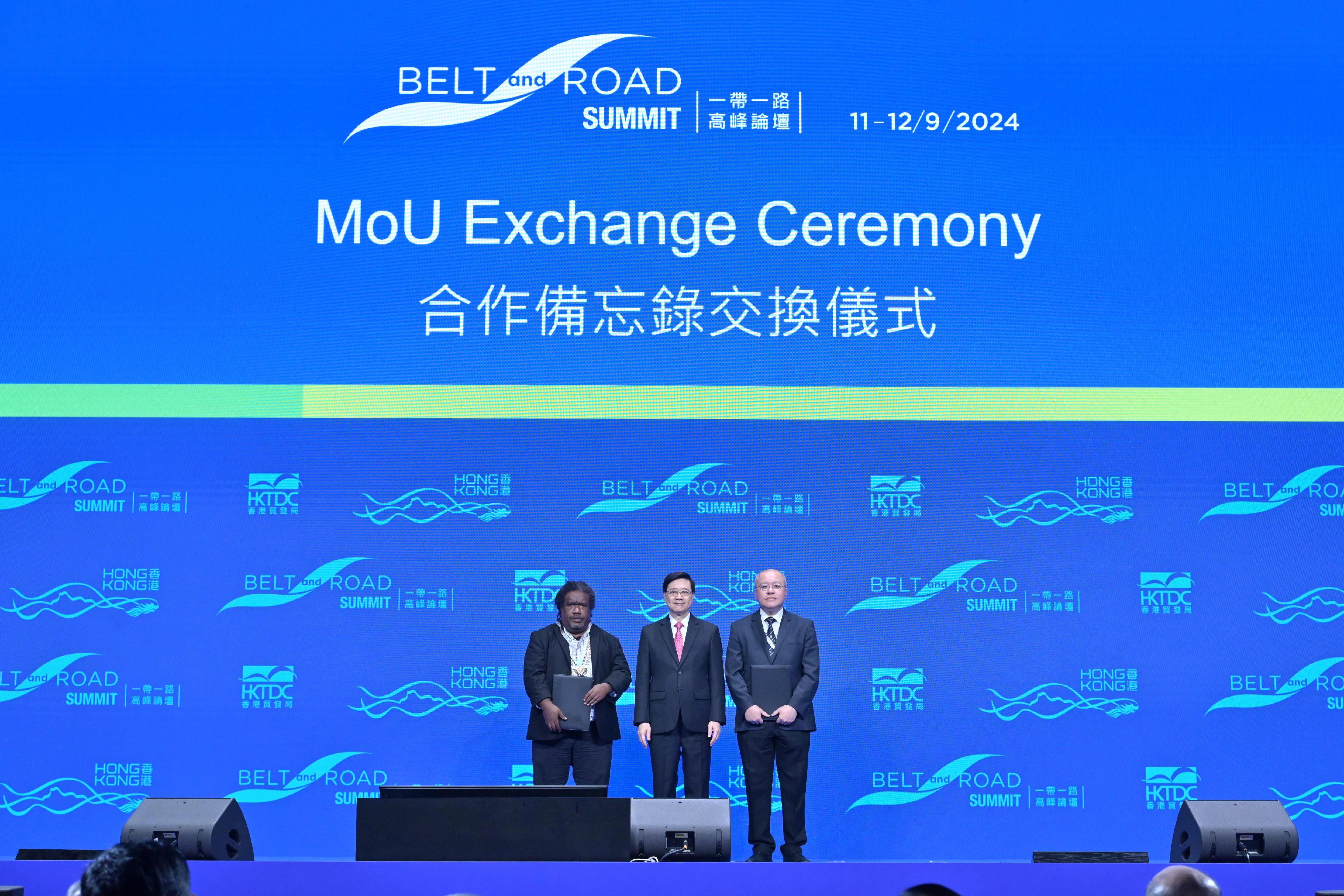 The Chief Executive, Mr John Lee, attended the Ninth Belt and Road Summit today (September 11). Photo shows Mr Lee (centre) witnessing the Director of the Hong Kong Observatory, Dr Chan Pak-wai (right), exchanging the Memorandum of Understanding with a representative from the Solomon Islands Meteorological Service.