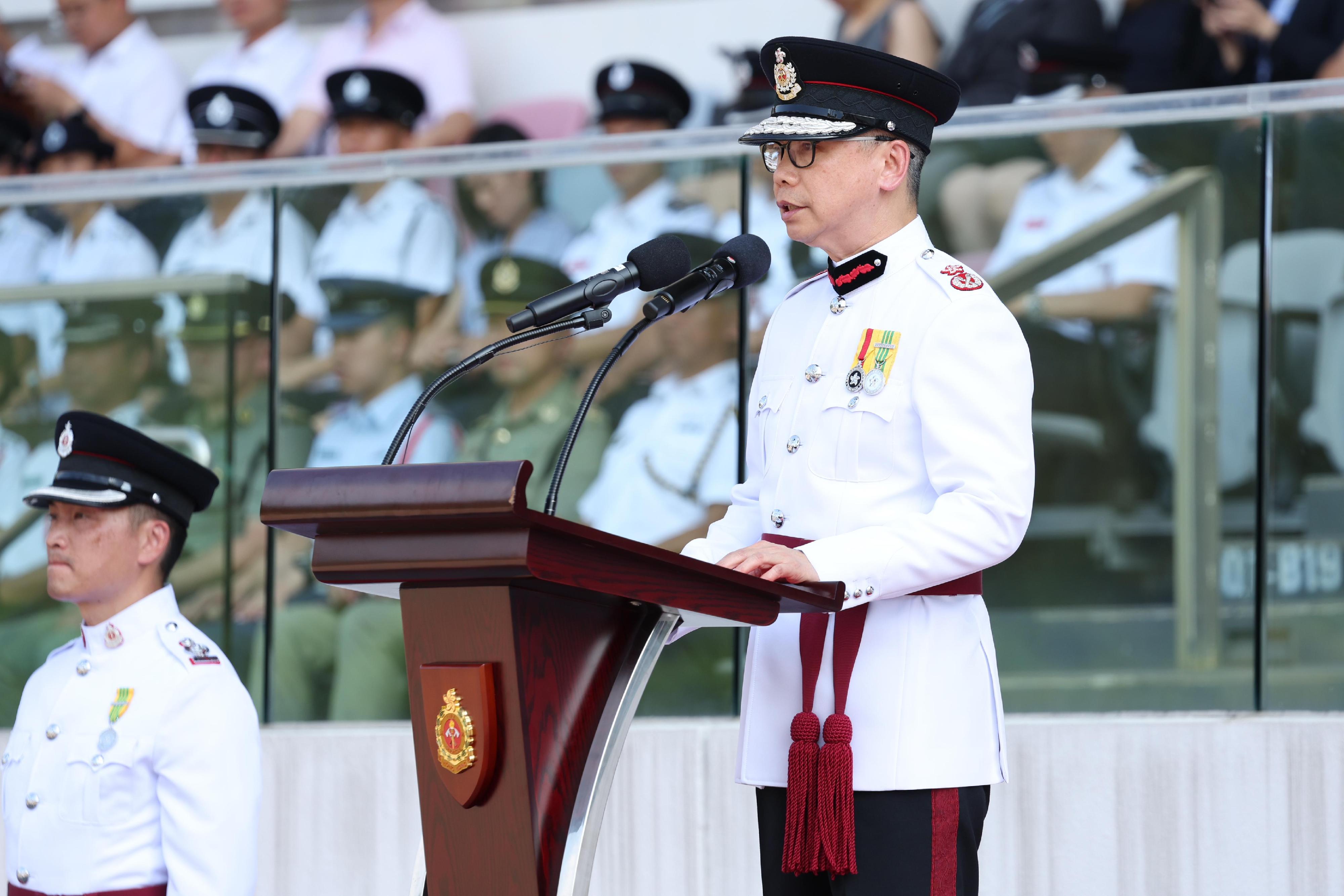 The Deputy Director of Fire Services (Operations), Mr Angus Wong, reviewed the Fire Services passing-out parade at the Fire and Ambulance Services Academy today (September 13). Photo shows Mr Wong delivering a speech at the ceremony.