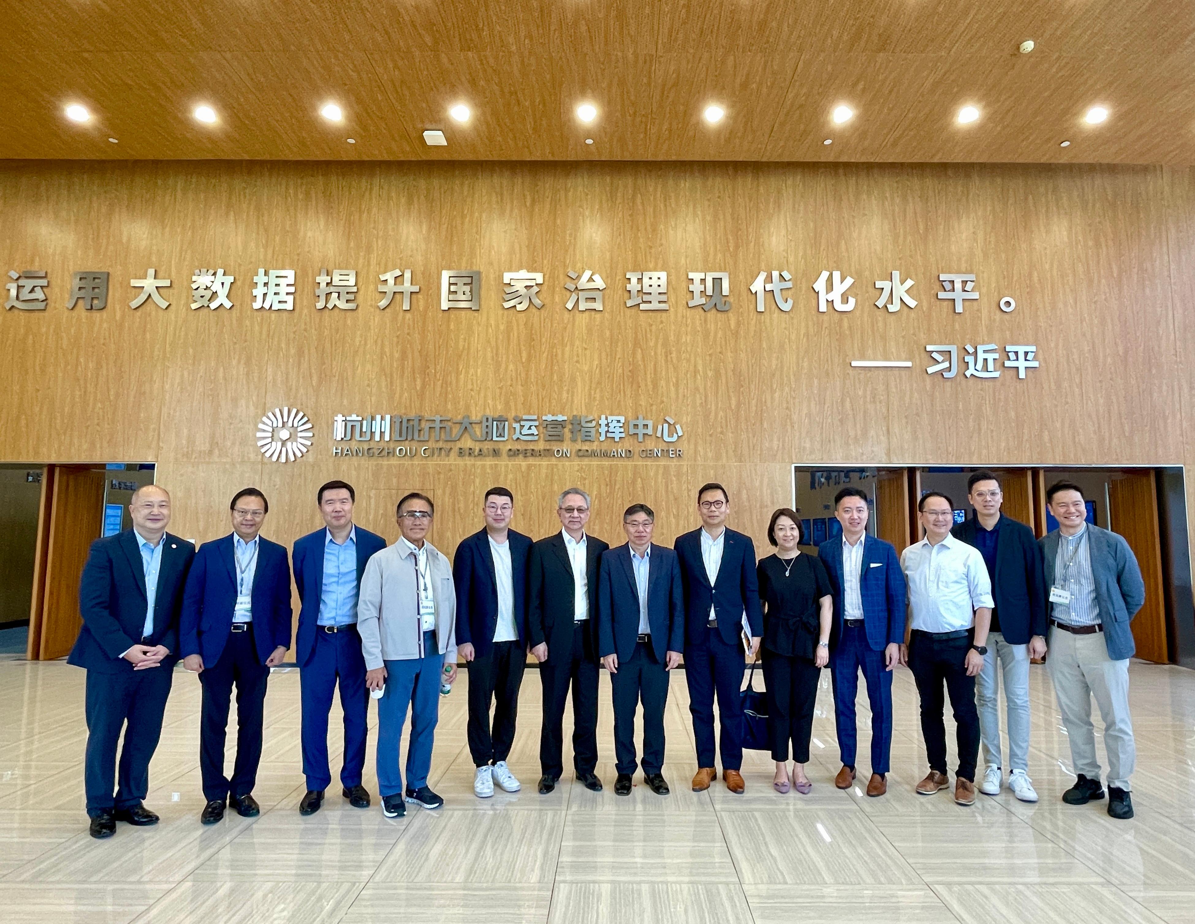 The Secretary for Transport and Logistics, Mr Lam Sai-hung, together with Members of the Legislative Council (LegCo) Panel on Transport, visited Hangzhou today (September 13). Photo shows Mr Lam (centre); the Chairman of the LegCo Panel on Transport, Dr Chan Han-pan (sixth right); the Commissioner for Transport, Ms Angela Lee (fifth right); and Panel Members visiting the Hangzhou City Brain Operation Command Center to learn about its operations.