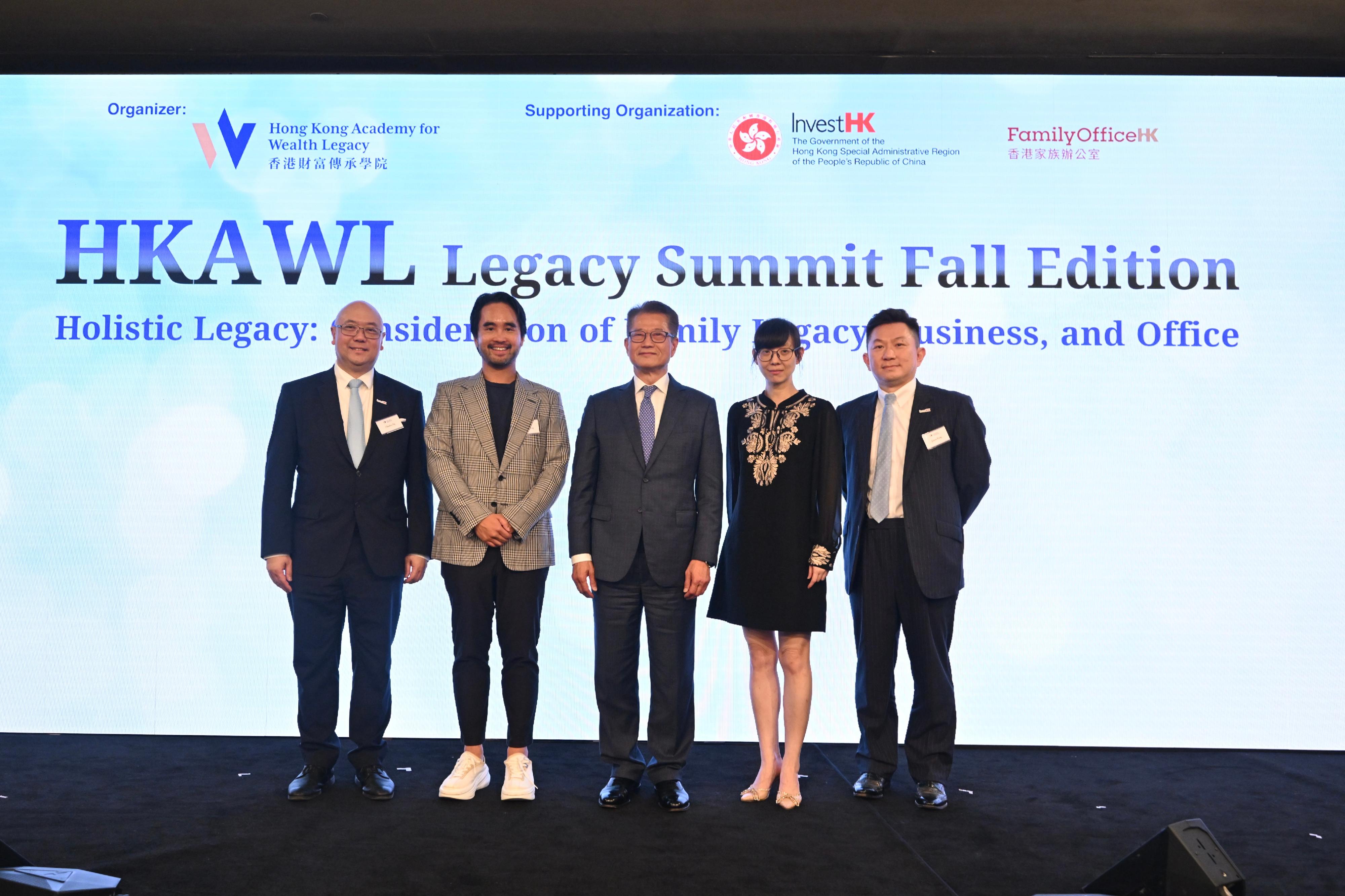 The Financial Secretary, Mr Paul Chan (centre), attends the HKAWL Legacy Summit Fall Edition today (September 13) and is pictured with the Chairman of the Hong Kong Academy for Wealth Legacy, Dr Adrian Cheng (second left), and other guests.