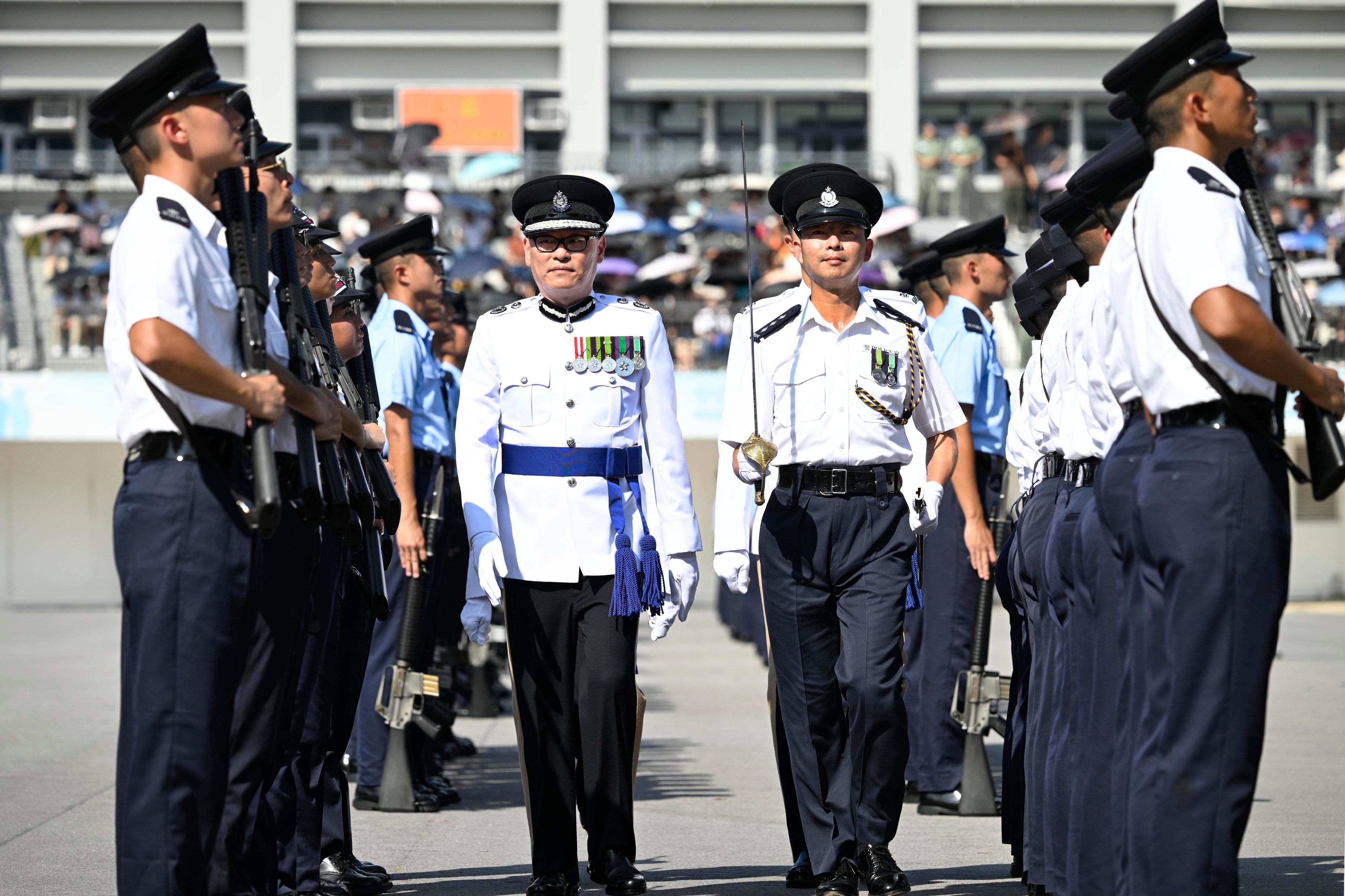 The Deputy Commissioner of Police (National Security), Mr Kan Kai-yan, inspects a passing-out parade as reviewing officer at the Hong Kong Police College today (September 14).