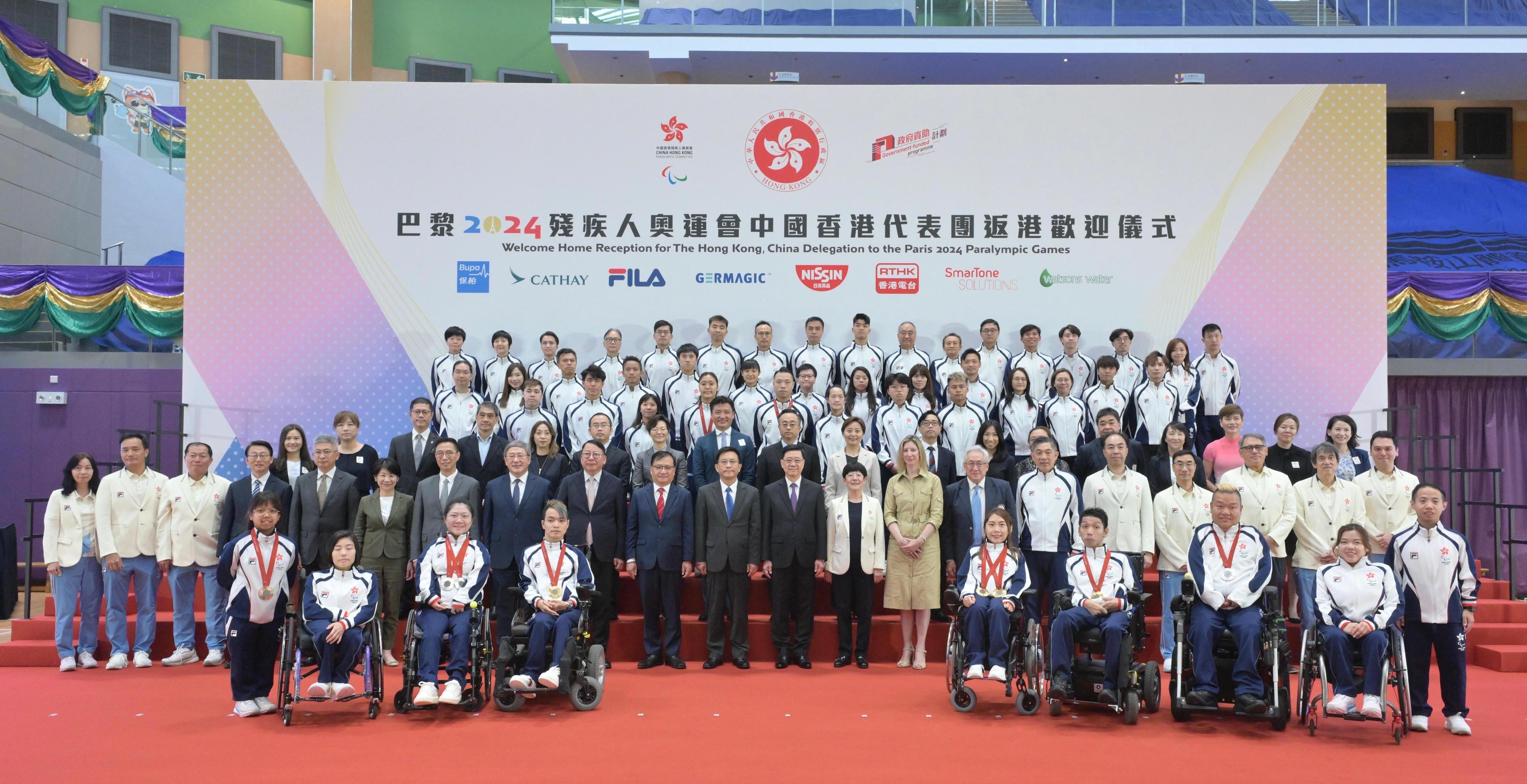 The Chief Executive, Mr John Lee, attended the Welcome Home Reception for the Hong Kong, China Delegation to the Paris 2024 Paralympic Games today (September 16). Photo shows (second row, from seventh left) the Secretary for Culture, Sports and Tourism, Mr Kevin Yeung; the Deputy Chief Secretary for Administration, Mr Cheuk Wing-hing; the Chief Secretary for Administration, Mr Chan Kwok-ki; Deputy Commissioner of the Office of the Commissioner of the Ministry of Foreign Affairs of the People's Republic of China in the Hong Kong Special Administrative Region (HKSAR) Mr Fang Jianming; the Secretary General of the Liaison Office of the Central People's Government in the HKSAR, Mr Wang Songmiao; Mr Lee; the President of the China Hong Kong Paralympic Committee, Mrs Jenny Fung; the Consul General of France in Hong Kong and Macao, Mrs Christile Drulhe; the Honorary President of the China Hong Kong Paralympic Committee, Dr York Chow; the Chef de Mission of Hong Kong, China Delegation to Paris 2024 Paralympic Games, Dr John Leung; Vice President of the China Hong Kong Paralympic Committee Dr Jim Luk; athletes of Hong Kong, China Delegation who participated in the Games and other delegation members at the reception.