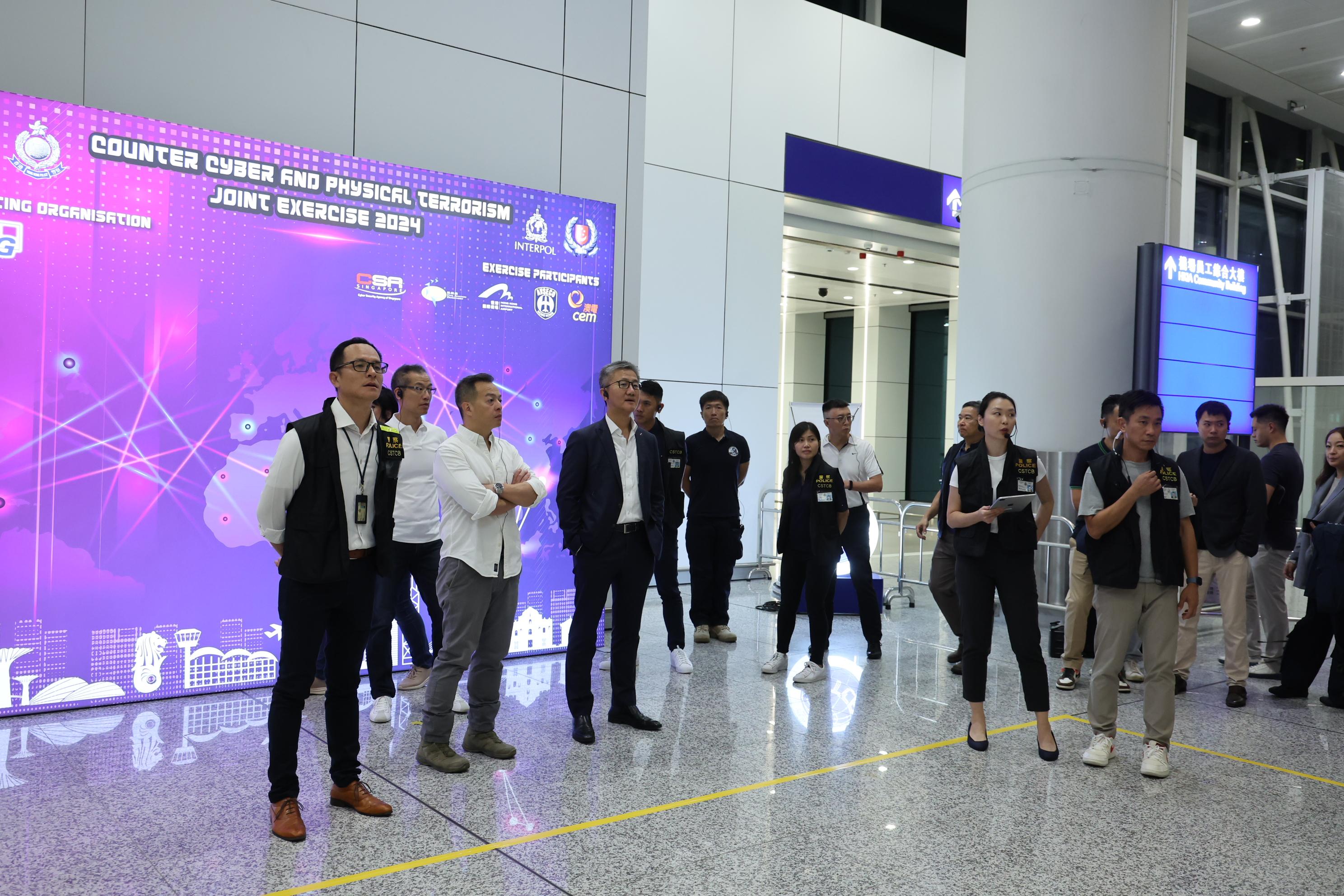 The Cyber Security and Technology Crime Bureau of the Hong Kong Police Force held the Counter Cyber and Physical Terrorism Joint Exercise 2024 codenamed BATTLEAIR in collaboration with the INTERPOL and the Macao Judiciary Police today (September 21). Photo shows the Commissioner of Police, Mr Siu Chak-yee (front row, third left), and the Deputy Commissioner of Police (Operations), Mr Chow Yat-ming (front row, second left) attending and monitoring the exercise.
