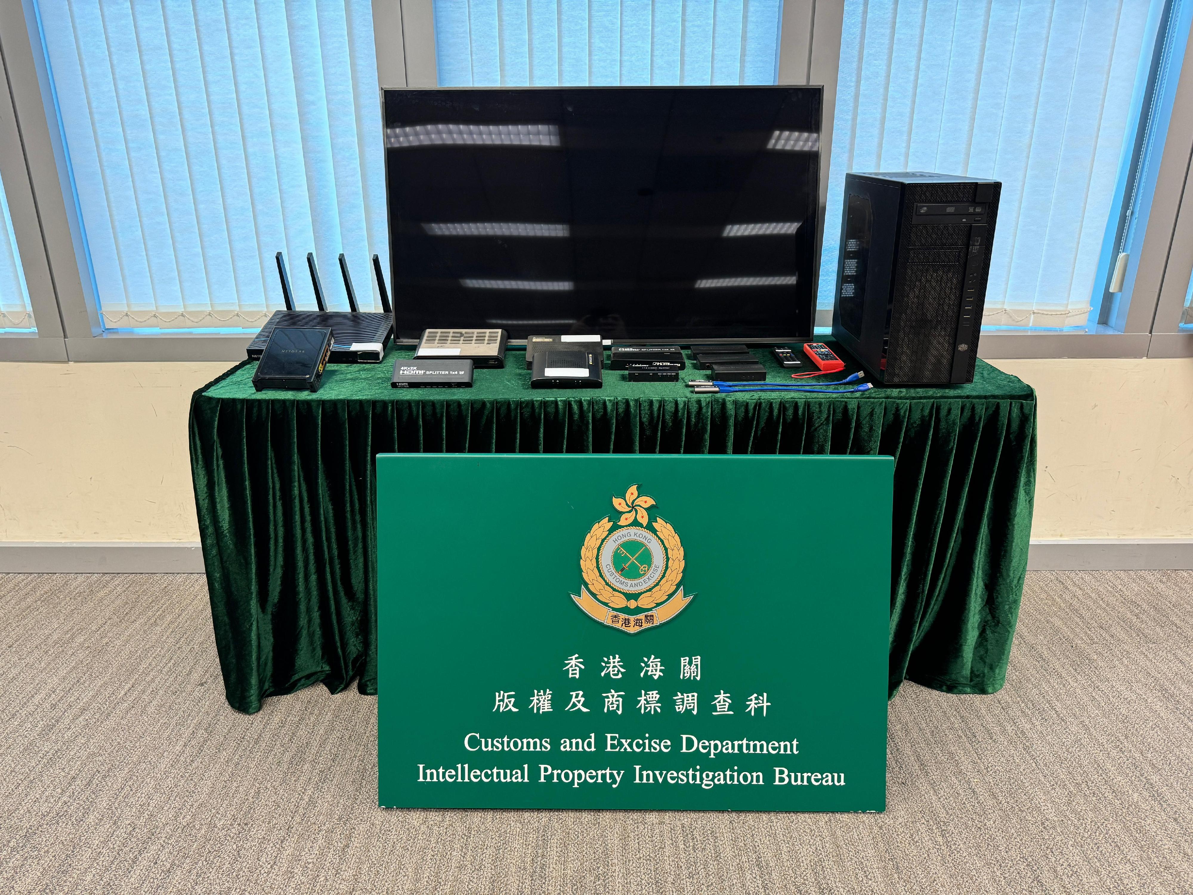 Hong Kong Customs conducted an enforcement operation on September 22 to combat infringement activities that utilise illegal streaming technology to communicate live football matches to the public. During the operation, Customs seized a pay-TV channel television decoder, a suspected illegal streaming computer server, a mobile phone used for a remote server operation and an assortment of electronic equipment and audio-visual devices, with a total estimated market value of about $20,000. Photo shows some of the suspected illegal streaming devices seized.