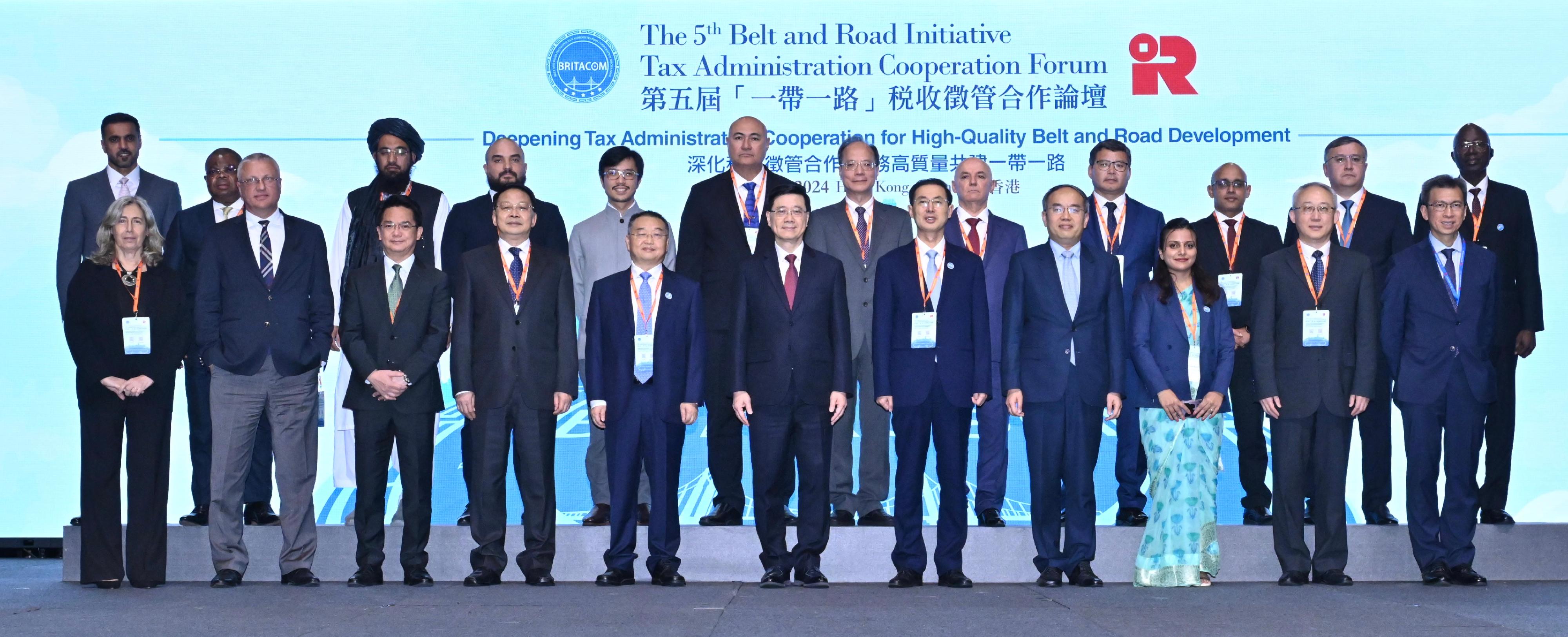 The 5th Belt and Road Initiative Tax Administration Cooperation Forum opened today (September 24). Photo shows the Chief Executive, Mr John Lee (front row, centre); the Commissioner of the State Taxation Administration, Mr Hu Jinglin (front row, fifth left); Deputy Director of the Liaison Office of the Central People’s Government in the Hong Kong Special Administrative Region (HKSAR) Mr Yin Zonghua (front row, fourth left); Deputy Commissioner of the Ministry of Foreign Affairs in the HKSAR Mr Li Yongsheng (front row, second right); the Deputy Commissioner of the State Taxation Administration and the Executive Secretary of the Belt and Road Initiative Tax Administration Cooperation Mechanism Secretariat, Mr Wang Daoshu (front row, fifth right); the Secretary for Financial Services and the Treasury, Mr Christopher Hui (front row, fourth right); the Permanent Secretary for Financial Services and the Treasury (Treasury), Mr Andrew Lai (front row, first right); the Commissioner of Inland Revenue, Mr Tam Tai-pang (front row, third left); and the Commissioner for Belt and Road, Mr Nicholas Ho (back row, fifth left), with other guests at the opening ceremony.