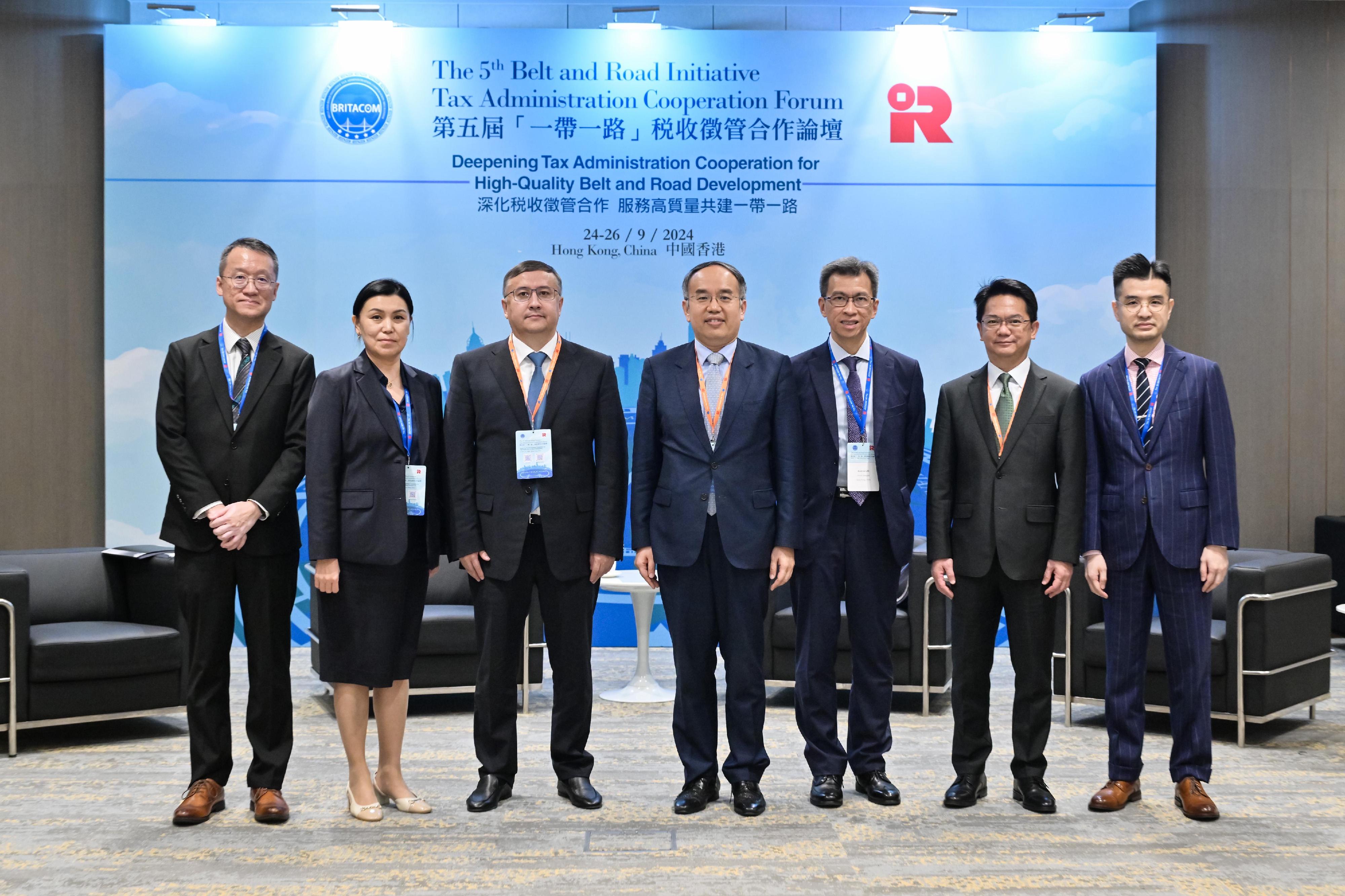 The Secretary for Financial Services and the Treasury, Mr Christopher Hui, today (September 24) held bilateral meetings with tax officials from other countries on the sidelines of the 5th Belt and Road Initiative Tax Administration Cooperation Forum to discuss deepening tax co-operation at the international and Belt and Road levels. Photo shows Mr Hui (centre); Deputy Chairman of the State Revenue Committee of the Ministry of Finance of Kazakhstan Mr Seilzhan Akhmetov (third left), with representatives of both sides at the bilateral meeting.