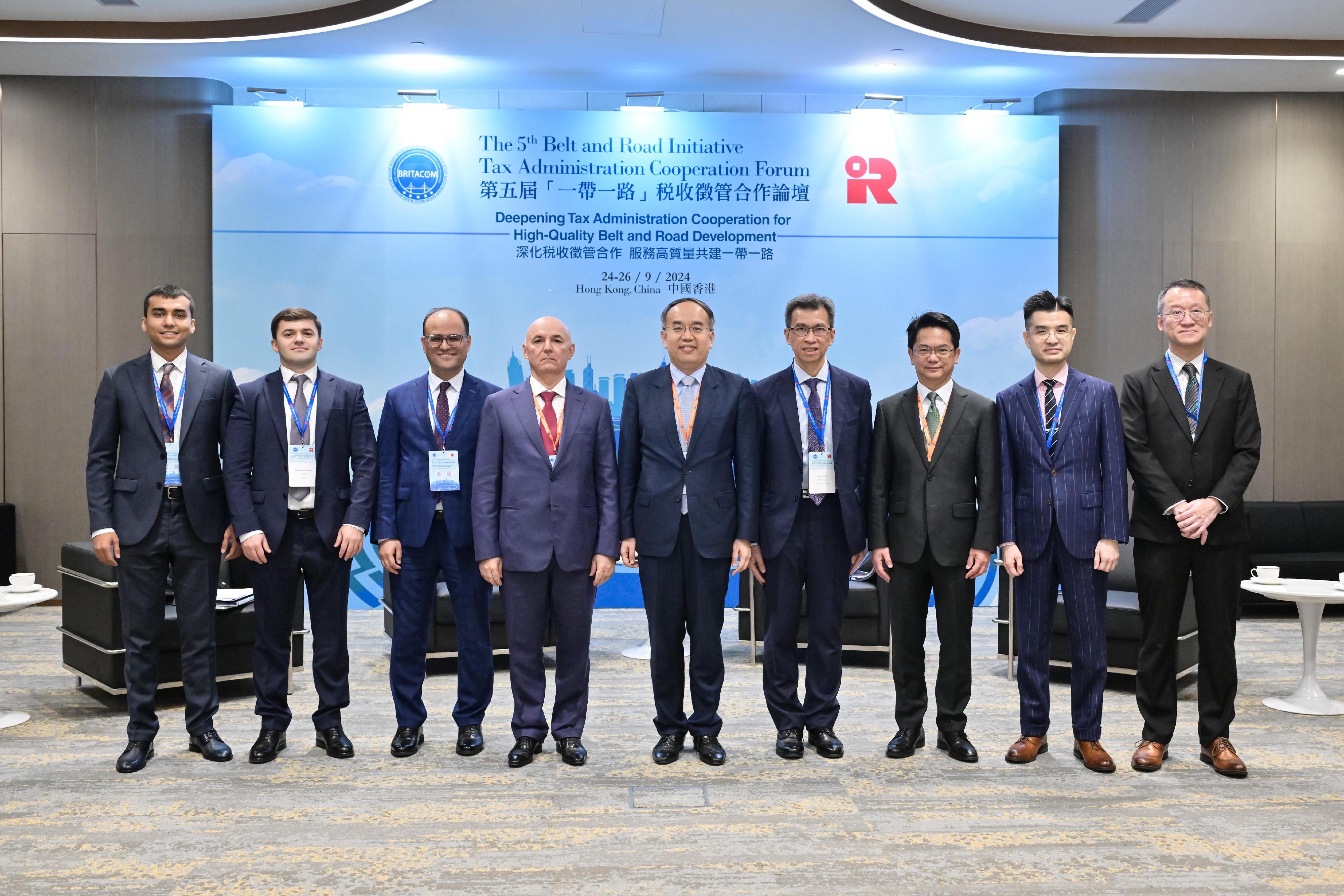 The Secretary for Financial Services and the Treasury, Mr Christopher Hui, today (September 24) held bilateral meetings with tax officials from other countries on the sidelines of the 5th Belt and Road Initiative Tax Administration Cooperation Forum to discuss deepening tax co-operation at the international and Belt and Road levels. Photo shows Mr Hui (centre); the Chairman of the Tax Committee of Tajikistan, Mr Davlatzoda Nusratullo (fourth left), with representatives of both sides at the bilateral meeting.