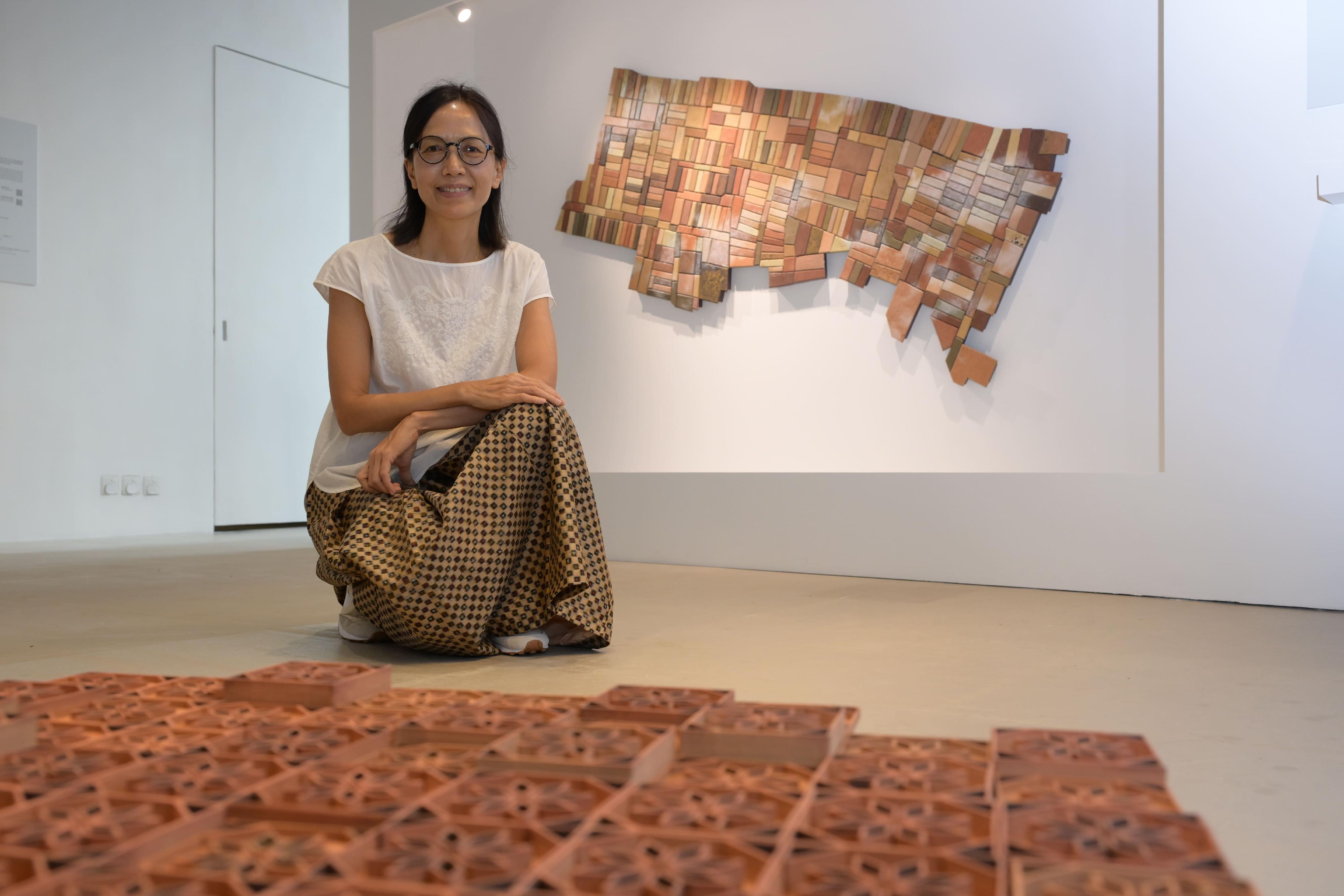 "The Charm of Colour - Travel with Ceramics through Time and Space" exhibition will be opened to the public from tomorrow (September 26) at Oi! Glassie. Photo shows artist Fiona Wong and her artwork "Sprawling out from Nam Koo Terrace".