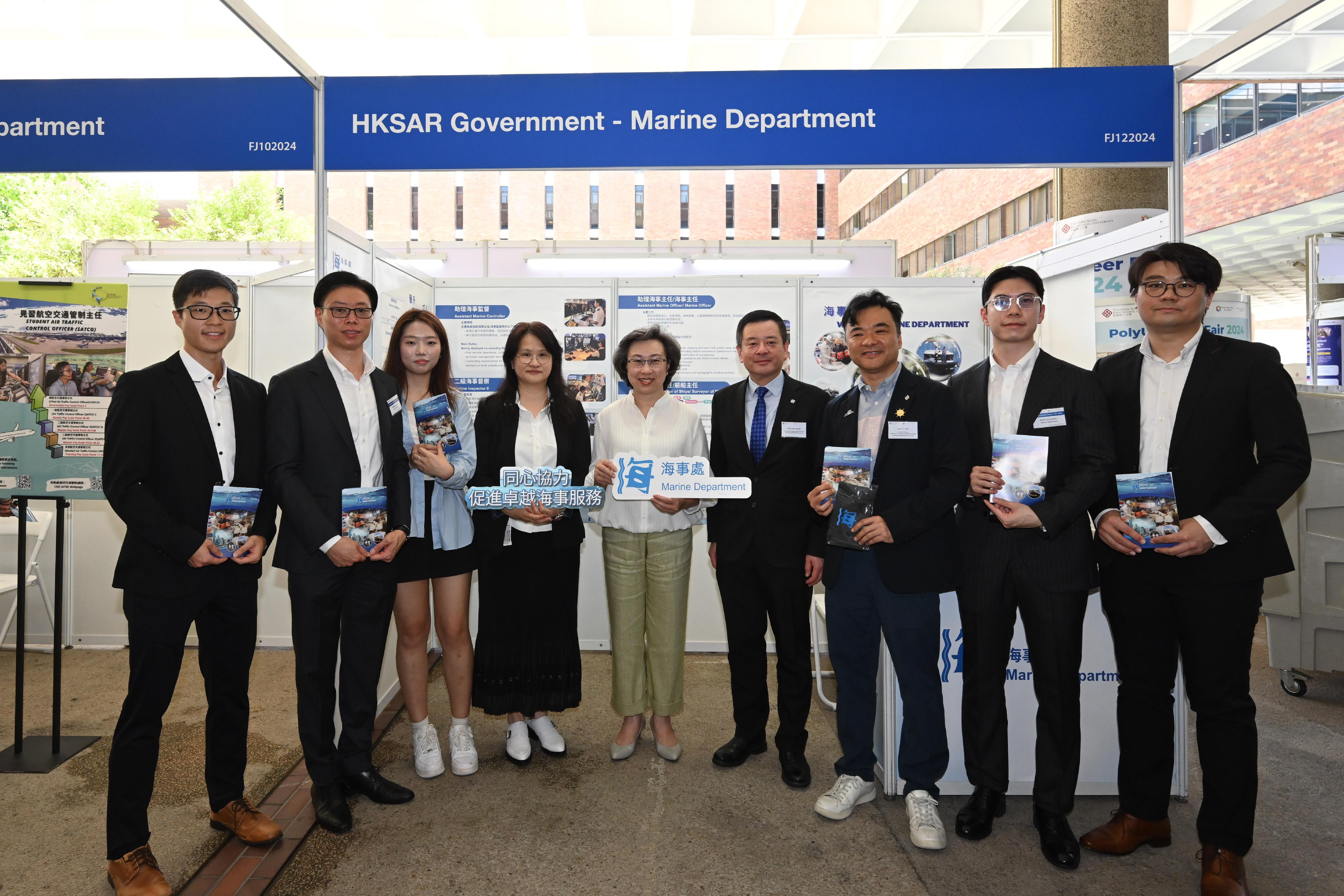 The Secretary for the Civil Service, Mrs Ingrid Yeung, attended the Government Career Fair at the Hong Kong Polytechnic University (PolyU) today (September 26). Mrs Yeung (centre) and the Vice President (Student and Global Affairs) of PolyU, Professor Ben Young (fourth right), are pictured with students of PolyU, Marine Department officers and others at the Marine Department booth.