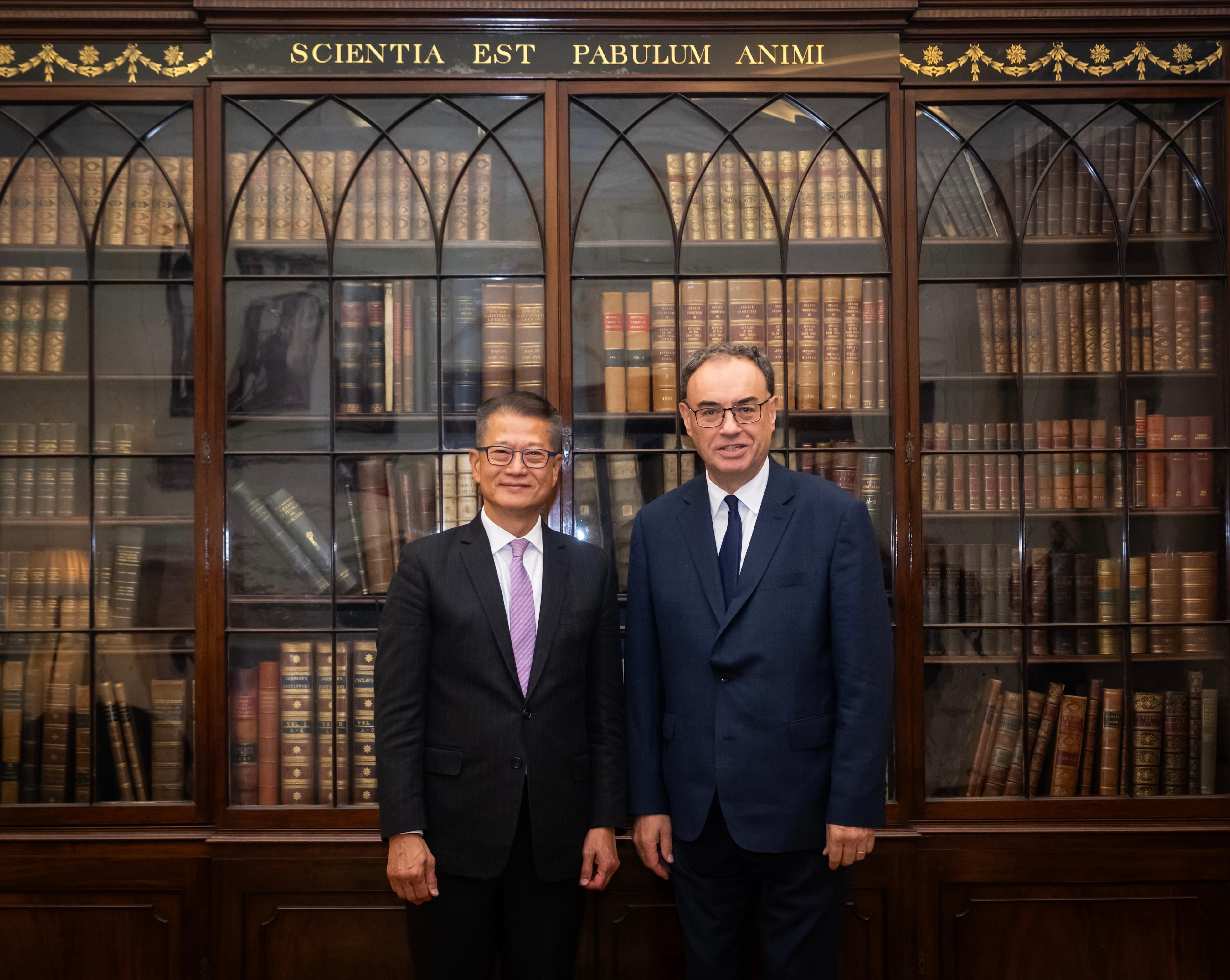 The Financial Secretary, Mr Paul Chan (left), meets with the Governor of the Bank of England, Mr Andrew Bailey (right), in London yesterday (September 26, London time). 