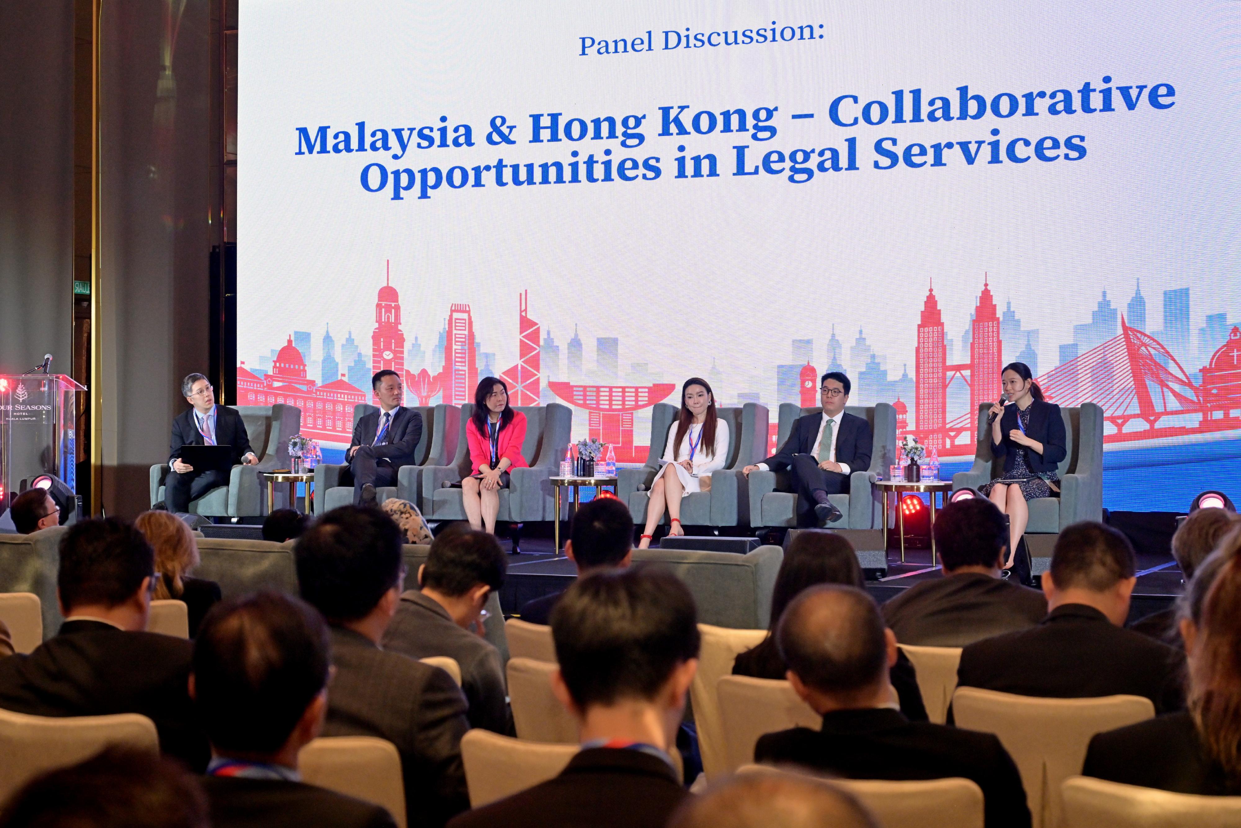 The Secretary for Justice, Mr Paul Lam, SC, leading a delegation comprising representatives from the Law Society of Hong Kong, the Hong Kong Bar Association and alternative dispute resolution organisations, attended a seminar titled "Hong Kong: The Common Law Gateway for Malaysian Businesses to China and Beyond", followed by an evening networking reception co-organised by the Department of Justice, the Hong Kong Economic and Trade Office in Jakarta and the National Chamber of Commerce and Industry of Malaysia in Kuala Lumpur, Malaysia today (September 26). Photo shows speakers sharing their views with the audience on various topics at the panel discussion of the seminar.

